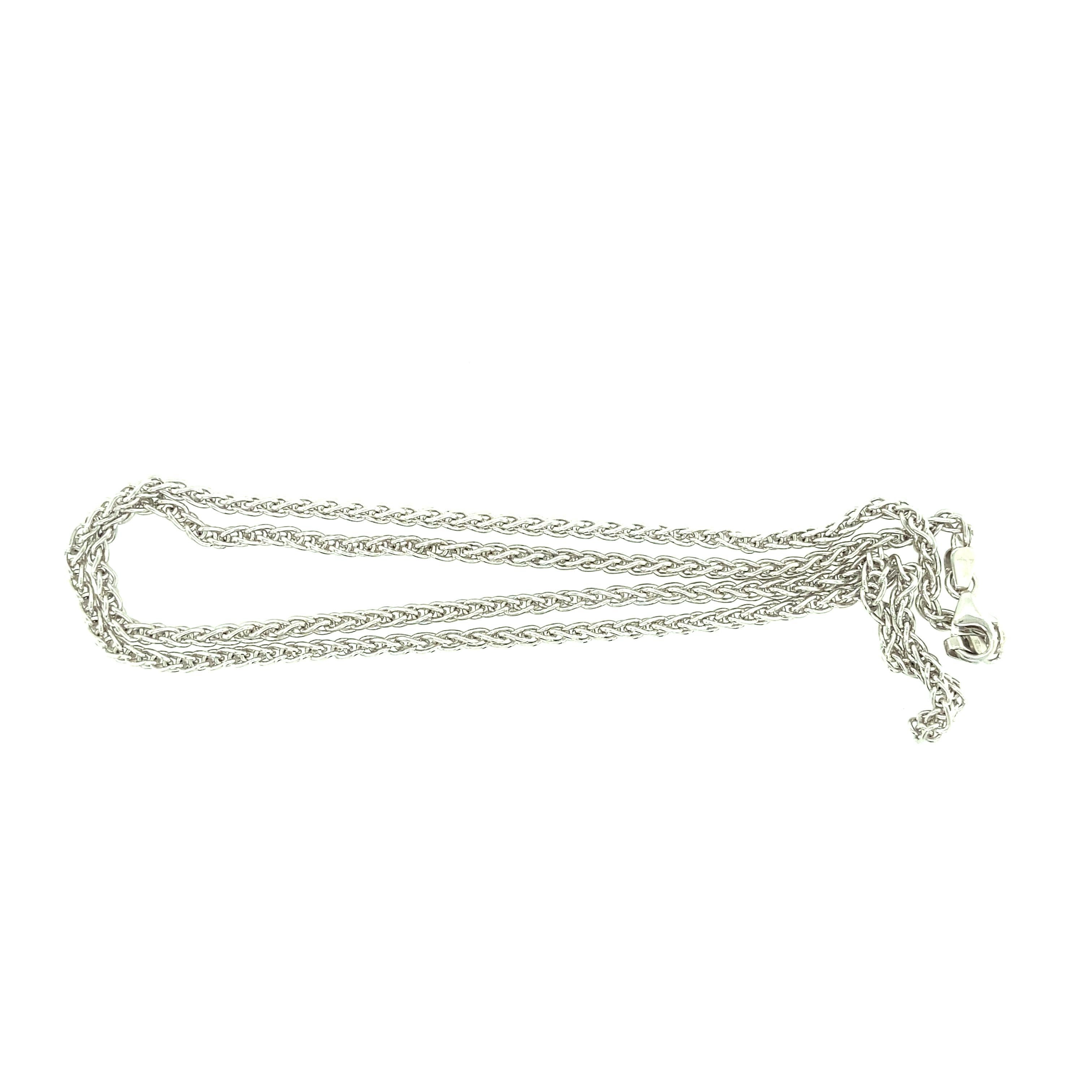 One 14 karat white gold (stamped 14KT ITALY) estate fox tail chain measuring 20 inches in length with a lobster clasp. The necklace weights 12.06 grams.  