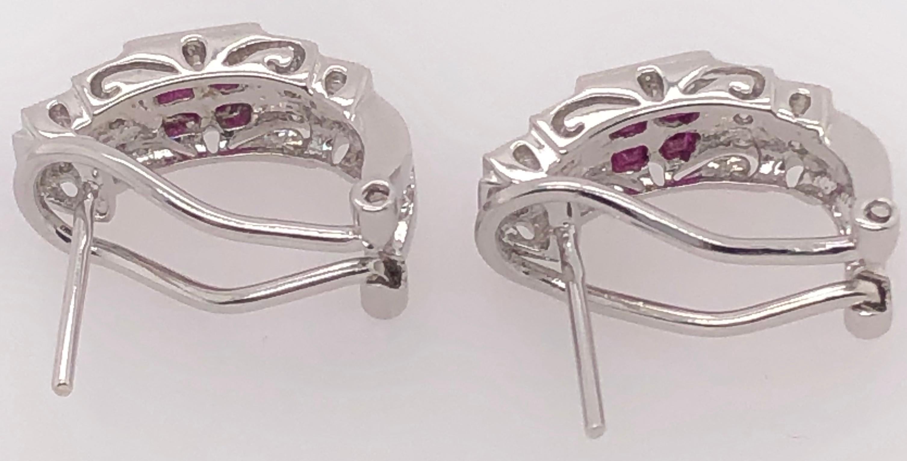 14 Karat White Gold French Back Half Hoop Ruby And Diamond Earrings
0.25 total diamond weight.
5.7 grams total weight.