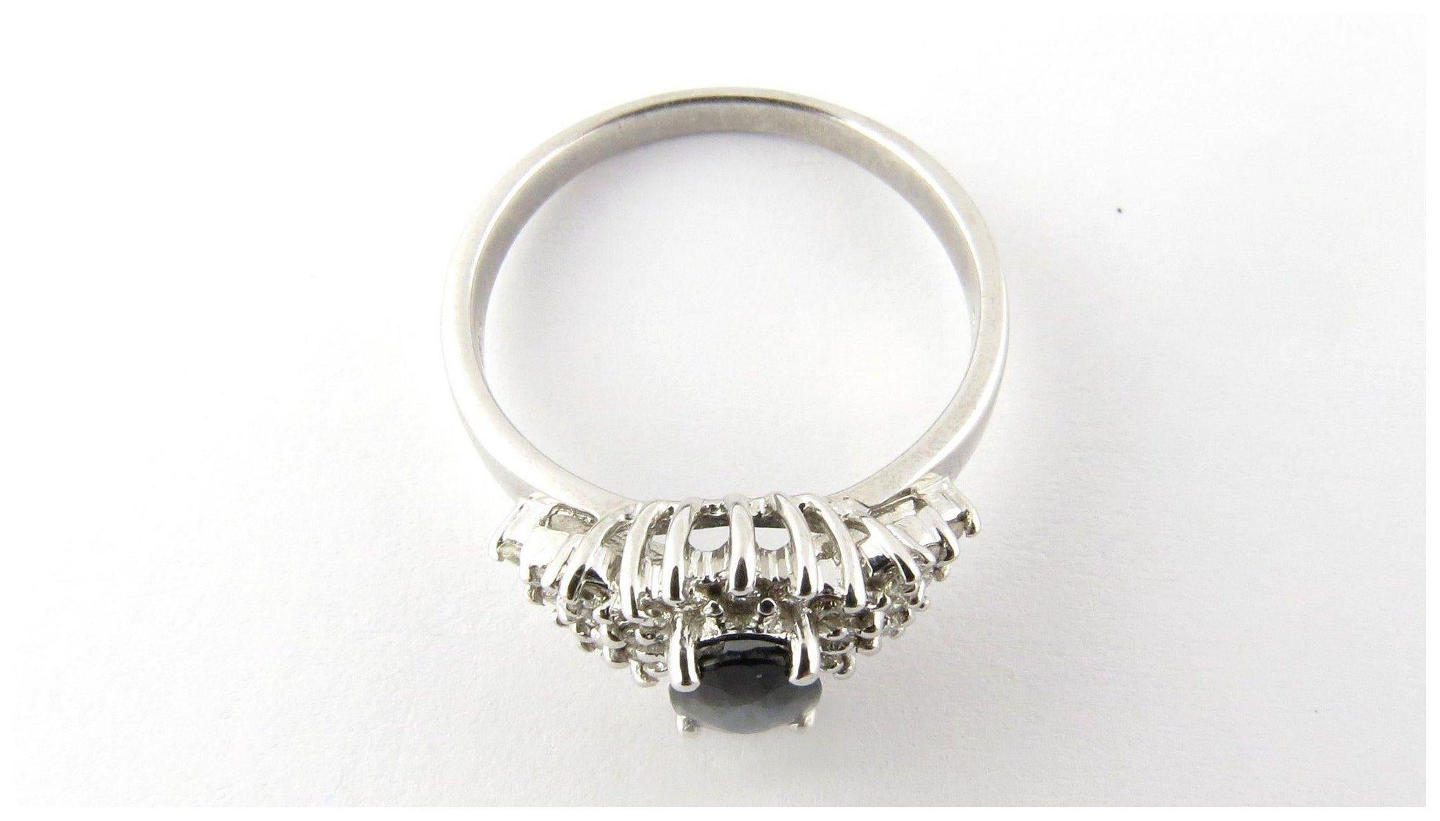 Vintage 14 Karat White Gold Genuine Sapphire and Diamond Ring Size 8.5- 
This lovely ring features one genuine oval sapphire (7 mm x 5 mm) surrounded by 26 round brilliant cut diamonds. Shank measures 2 mm. Top of ring measures 11 mm x 17 mm.