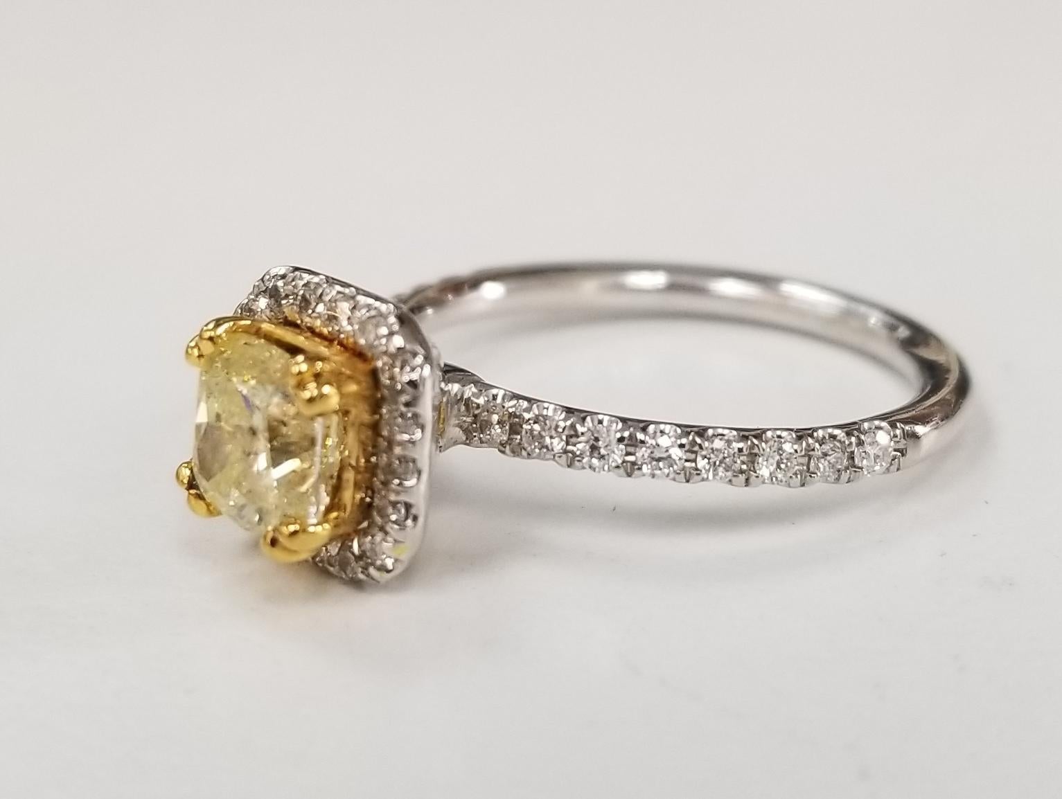
14 Karat White Gold GIA .90pts, Natural Fancy Yellow Diamond Halo Ring; 
Specifications:
    main stone: GIA .90pts, Natural Fancy Yellow Cushion cut Diamond
    additional: DIAMONDS
    diamonds: 36 round full cut 
    carat total weight: 0.38