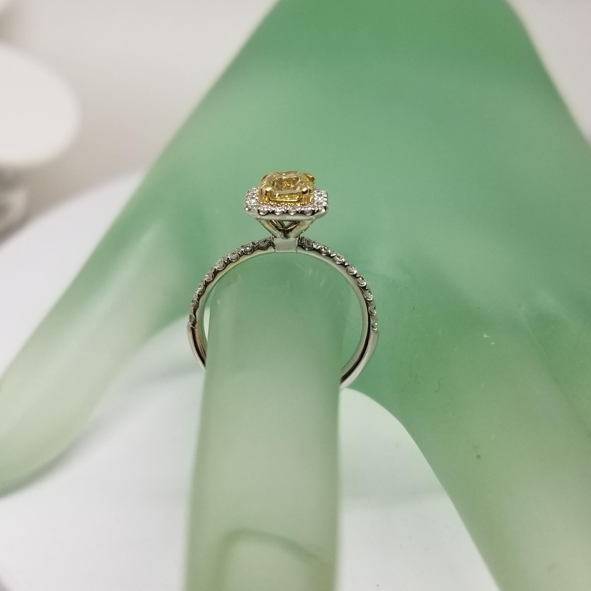 Modern 14 Karat White Gold GIA .90pts, Natural Fancy Yellow Diamond Halo Ring For Sale