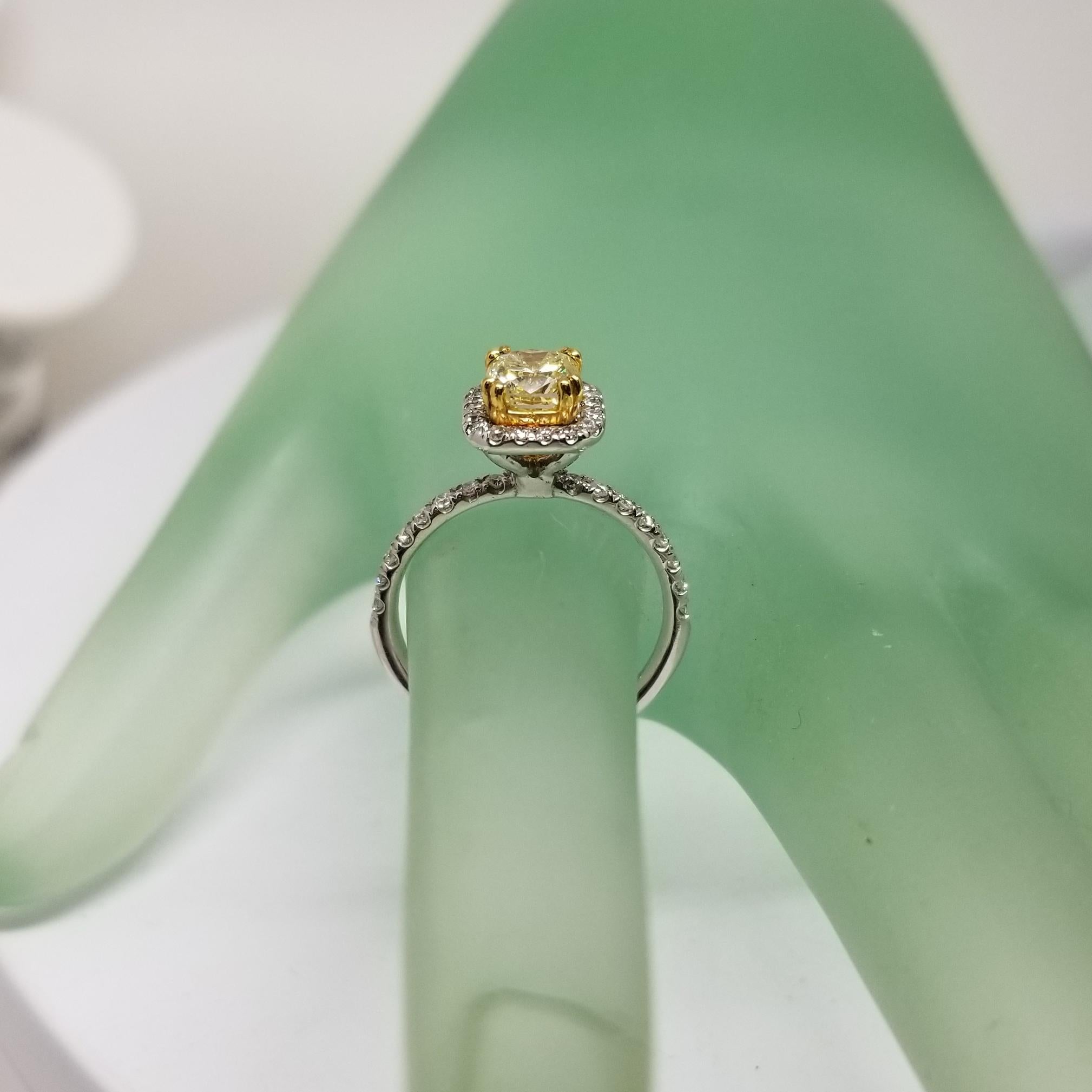Modern 14 Karat White Gold GIA .90pts, Natural Fancy Yellow Diamond Halo Ring For Sale