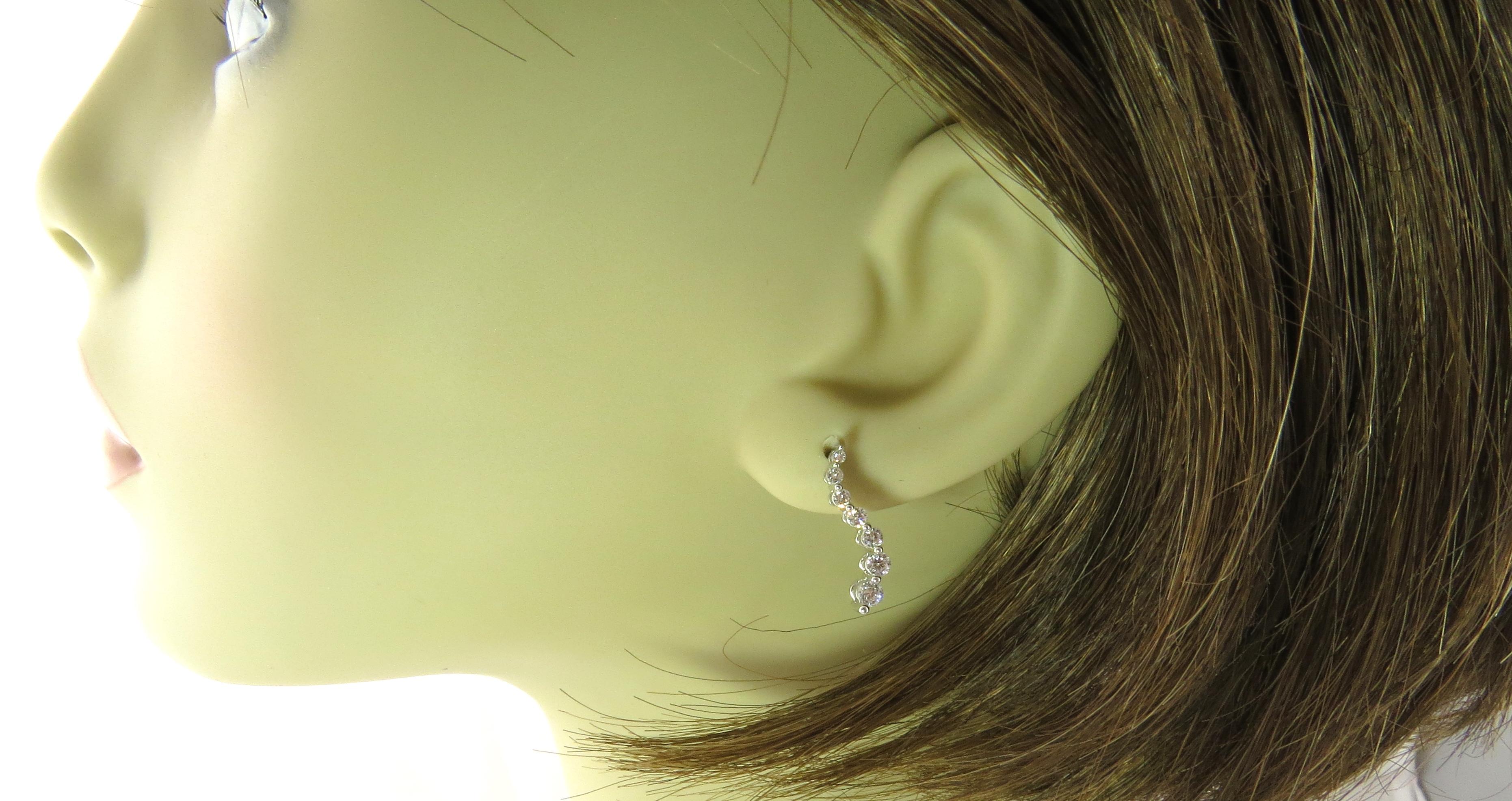 14 Karat White Gold Graduated Diamond Wave Earrings For Sale 1