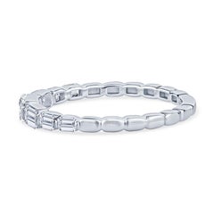 14 Karat White Gold Graduated Emerald Cut Diamond Band