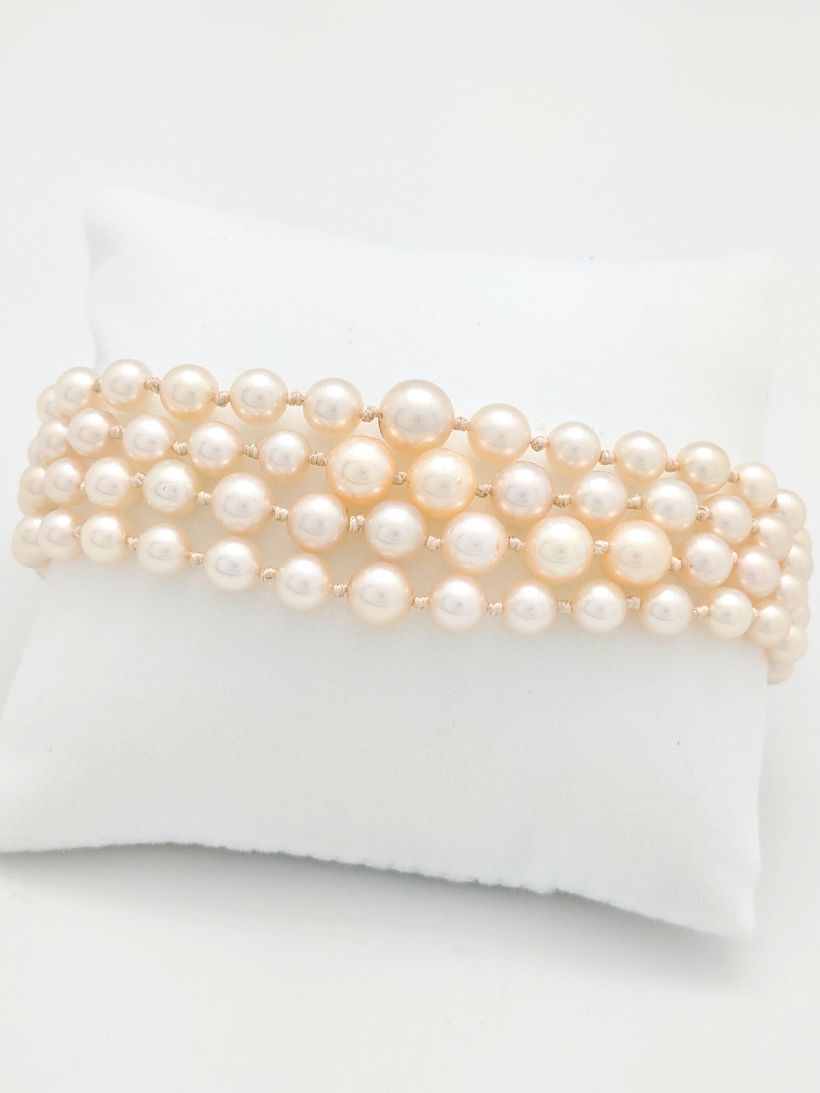 You are viewing a Beautiful Multi-Strand Pearl Bracelet that is sure to make a statement! The bracelet is crafted from 14k white gold, measures 1