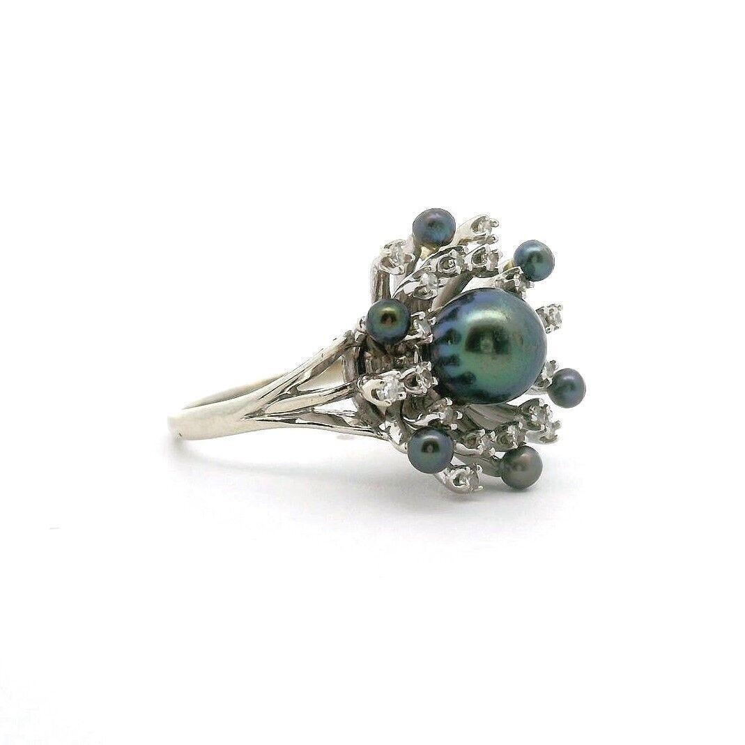 14k White Gold Gray Pearl and Diamond Fancy Ring Size 7

Condition:  Excellent Condition, Professionally Cleaned and Polished
Metal:  14k Gold (Marked, and Professionally Tested)
Weight:  7g
Gemstone:  7.5mm Center Gray Pearl, 3mm Accent Gray