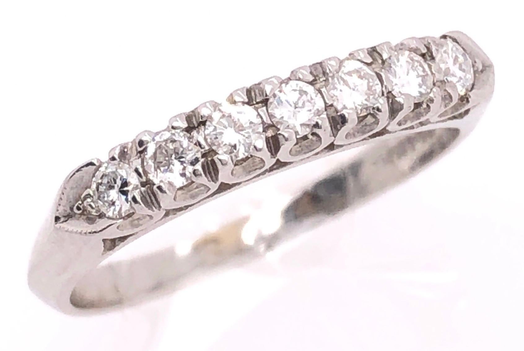 14 Karat White Gold Half Anniversary Ring with Diamonds 0.75 TDW.
Size 7.75
3.77 grams total weight.