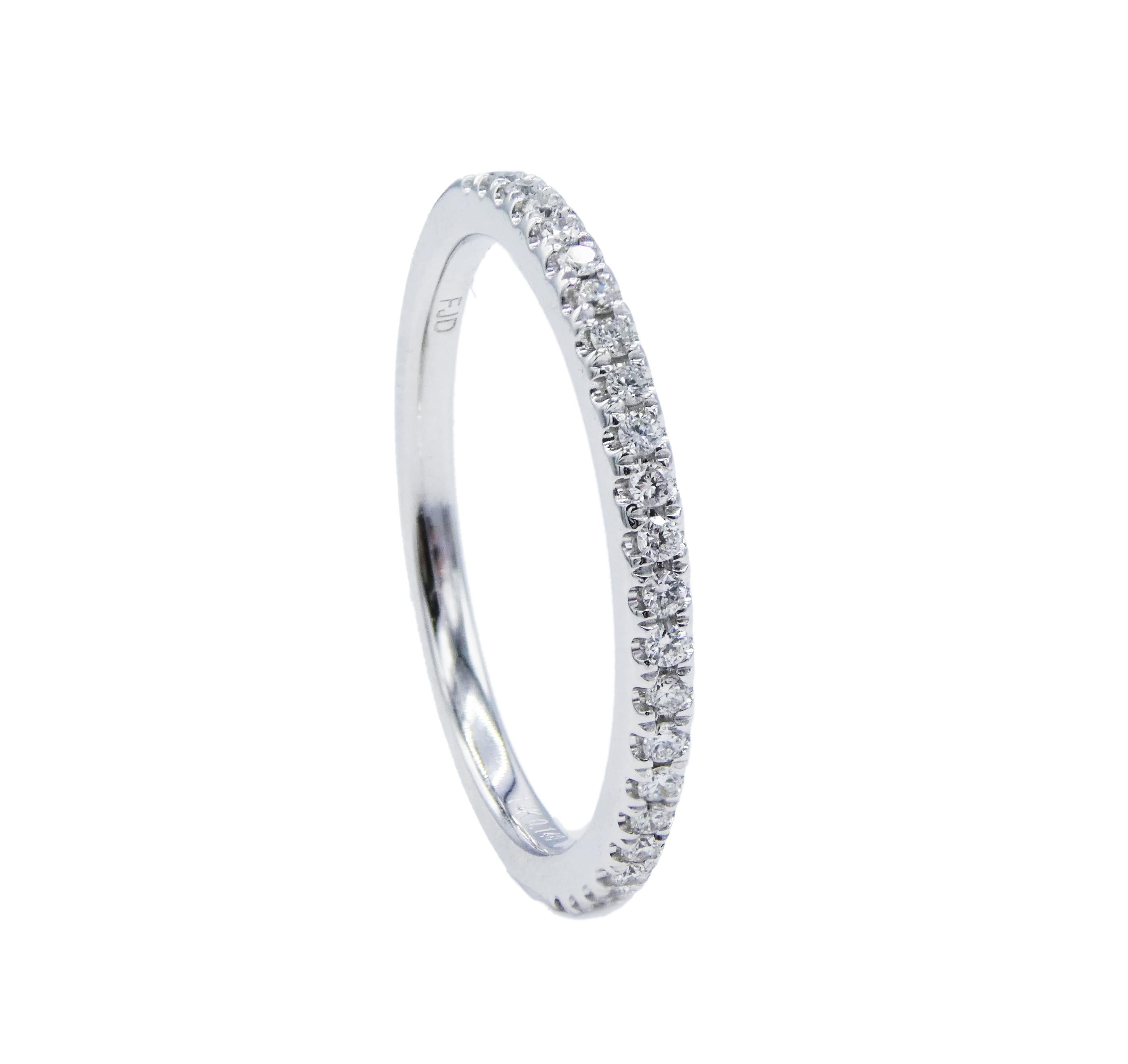 14 Karat White Gold Half Natural Diamond Wedding Band Ring Size 6
Metal: 14k White Gold
Weight: 1.71 grams
Diamonds: 23 round brilliant cut natural diamonds, .14 CTW G VS
Size: 6 (US)
Width: 1.6MM
Stamped: 