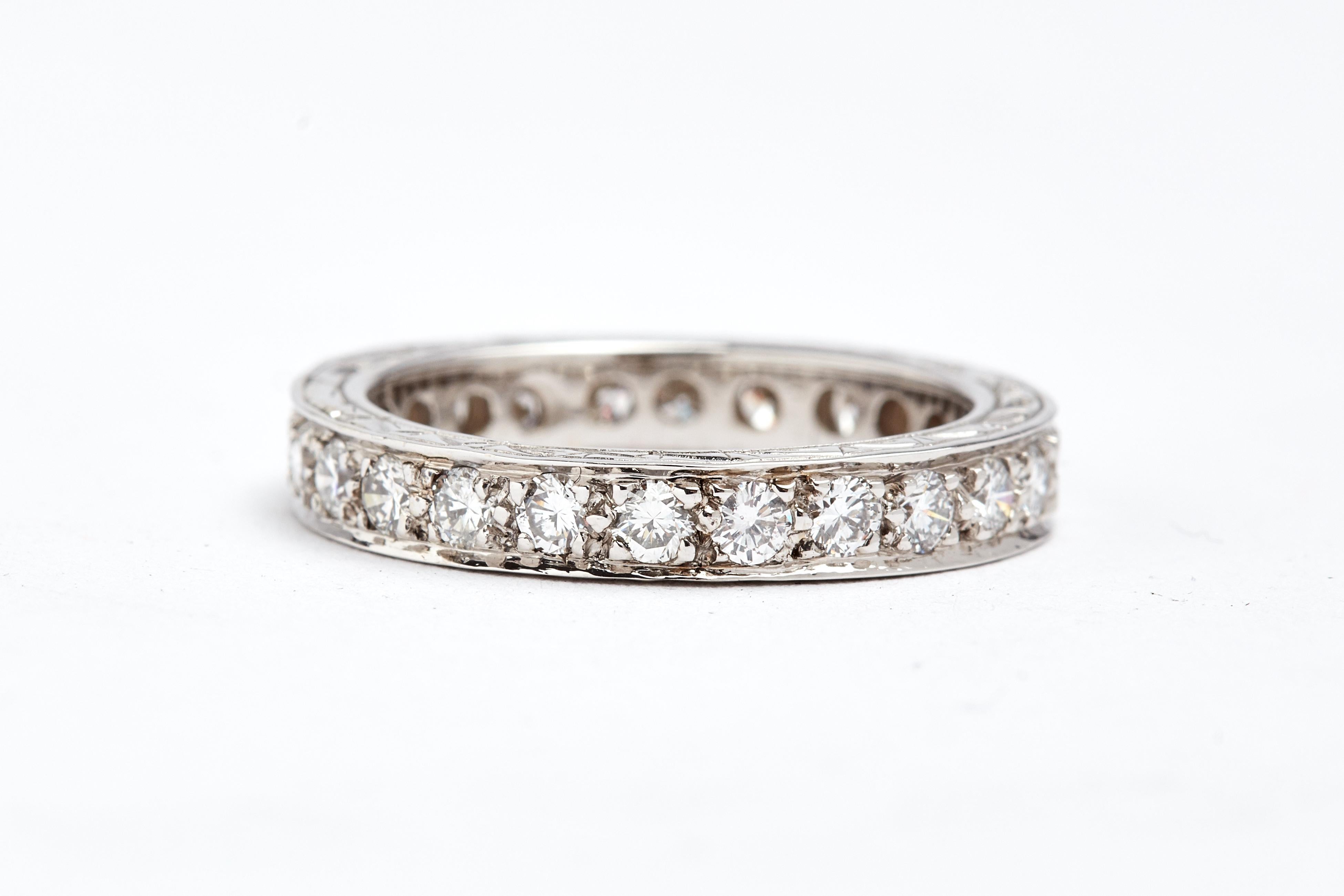 14 Karat White Gold Hand Carved Channel Set Eternity Band In Good Condition In New York, NY