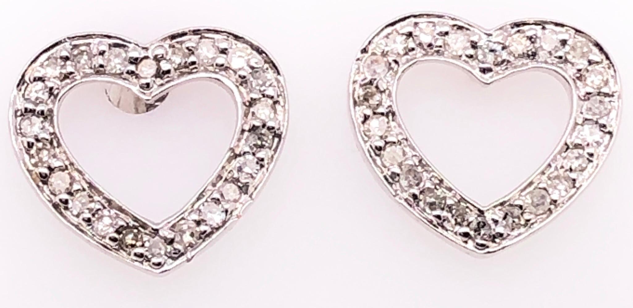 14 Karat white Gold Heart Button Earrings with Round Diamonds.
0.30 total diamond weight.
1 gram total weight.