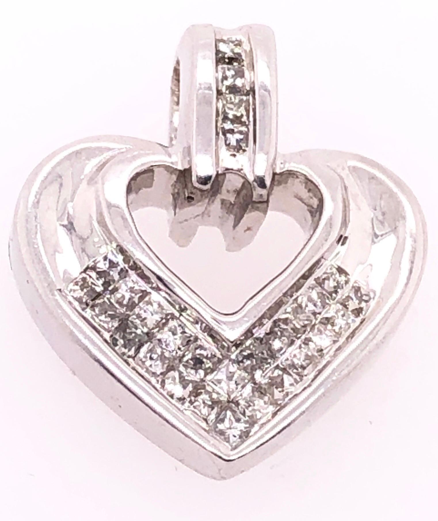 14 Karat White Gold Heart Pendant with Princess Cut Diamonds 0.25 TDW.
2.43 grams total weight.