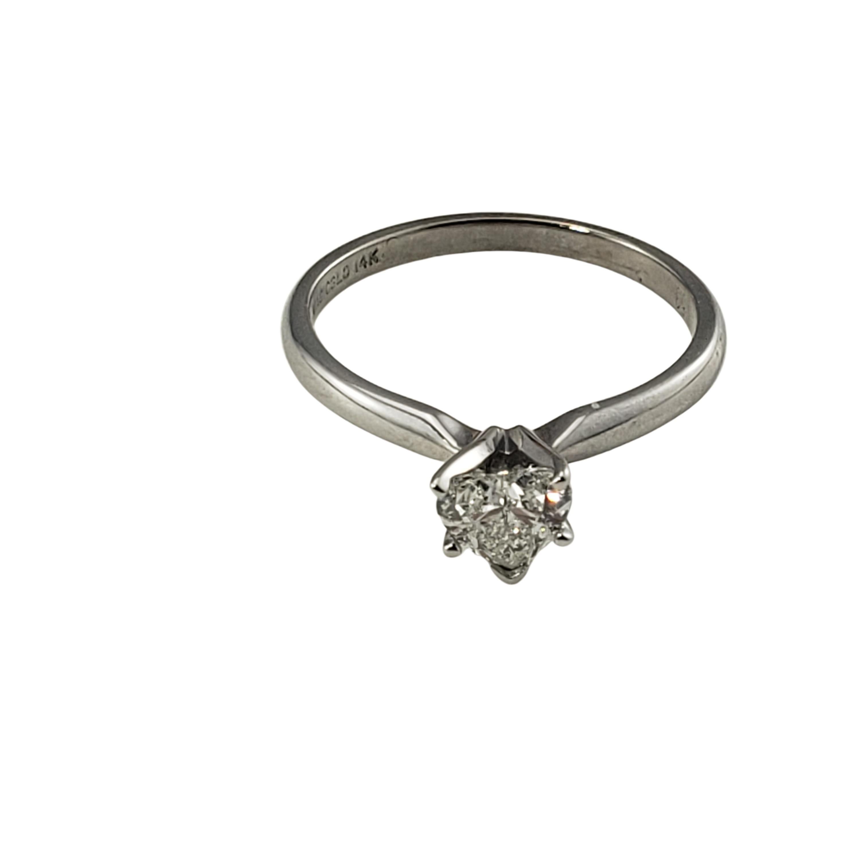 14 Karat White Gold Heart Shaped Diamond Engagement Ring Size 6.75-

This romantic engagement ring features one sparkling heart-shaped diamond set in classic 14K white gold.  Shank: 1.5 mm.

Approximate total diamond weight:  .50 ct.

Diamond color: