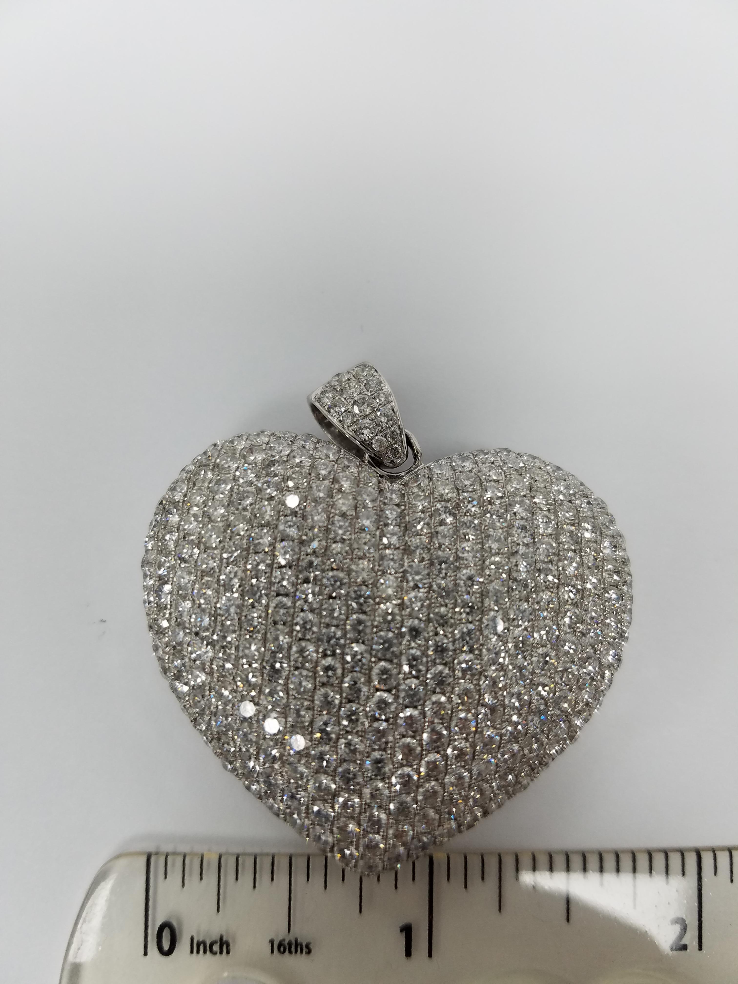 14K white gold pendant with aprox 10.75 carats of diamonds. 