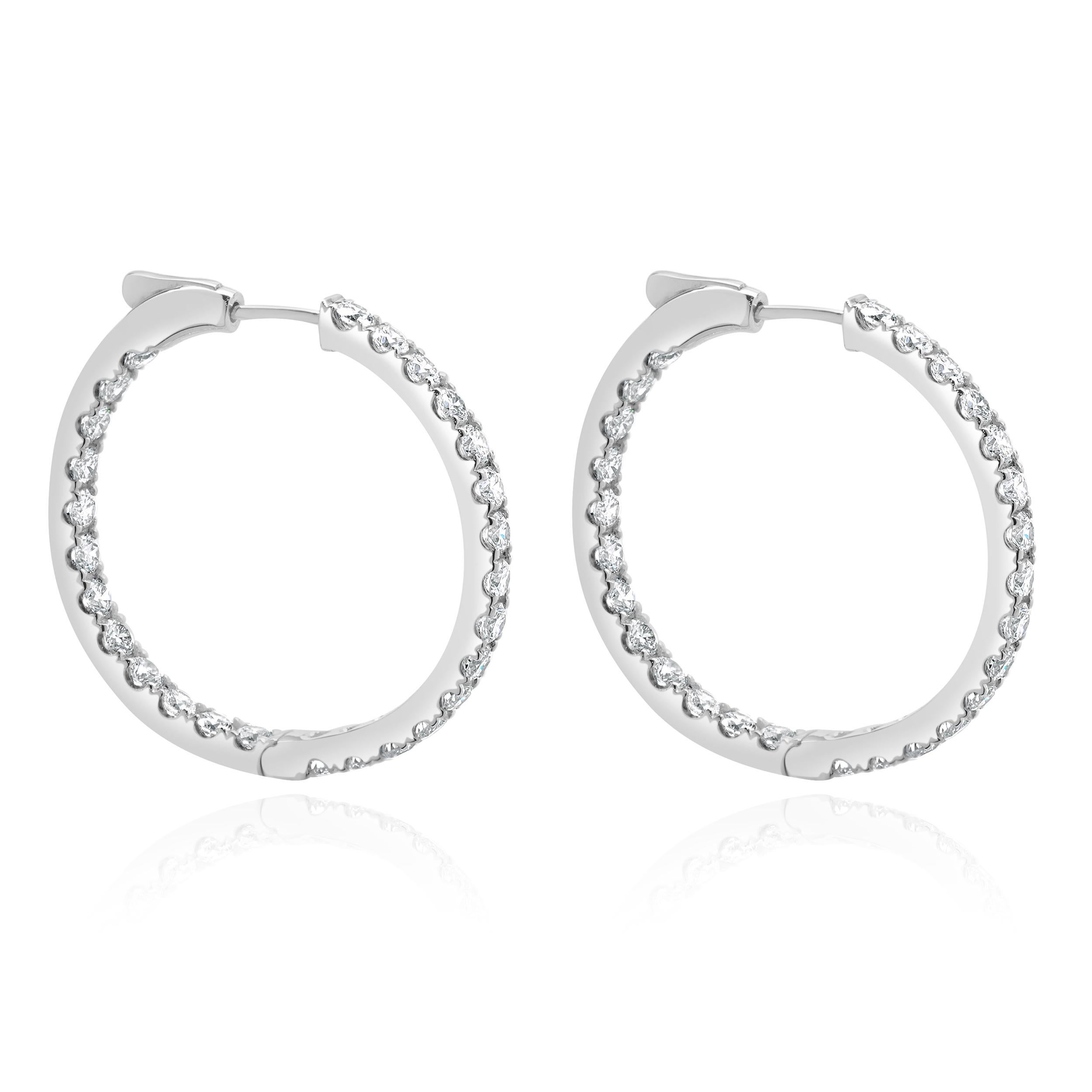 Designer: custom
Material: 14K white gold
Diamond: 54 round brilliant cut = 3.00cttw
Color: G
Clarity: VS2
Dimensions: earrings measure 25mm in length
Weight: 7.20 grams
