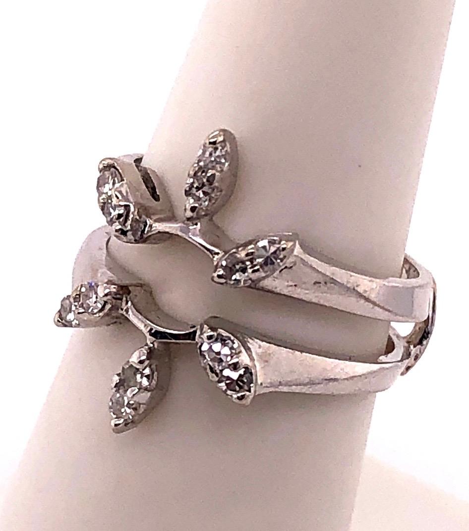14 Karat White Gold Interlocking Engagement  Ring Guard Size 6.5.
12 piece round diamonds
4.7 grams total weight.
ring space height 3 mm