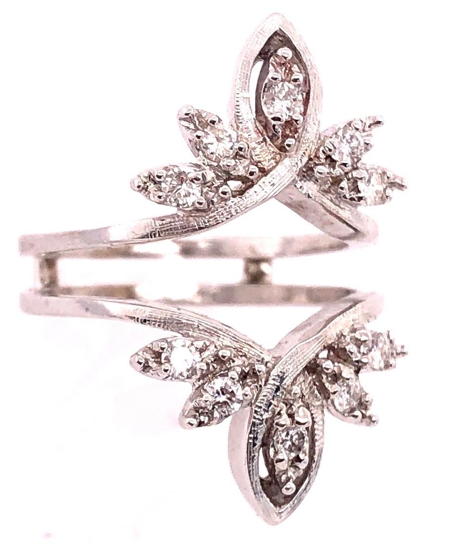 14 Karat White Gold Interlocking Engagement Ring Guard Size 6.75.
10 piece round diamonds
6 grams total weight.
ring space height 6 mm 