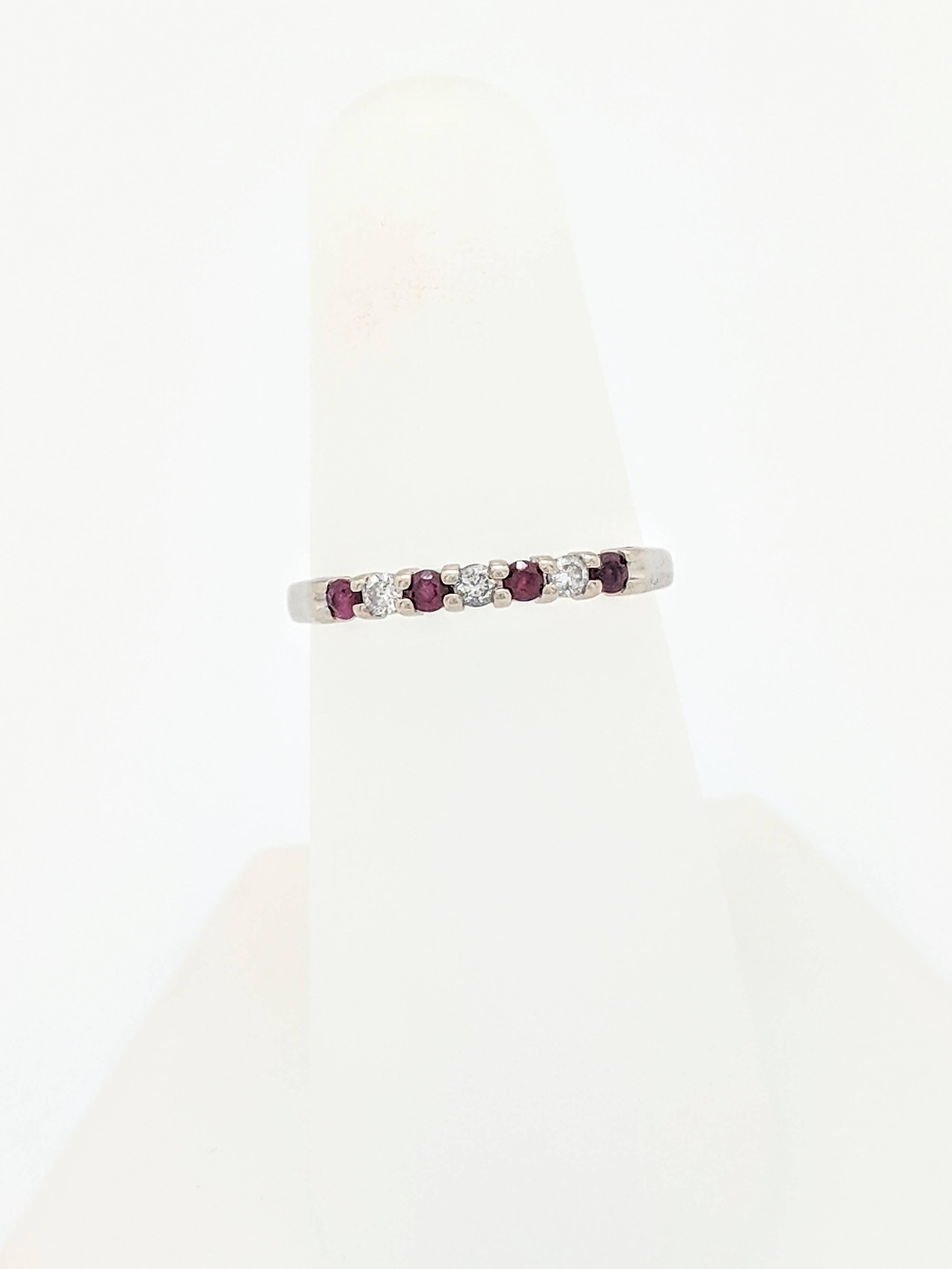 14K White Gold Kuber Ruby & Diamond Band Ring

You are viewing a beautiful Kuber Ruby & Diamond Band. This band is crafted from 14K white gold and weighs 1.6 grams. This ring features (4) .03ct round natural rubies and (3) .03ct natural round