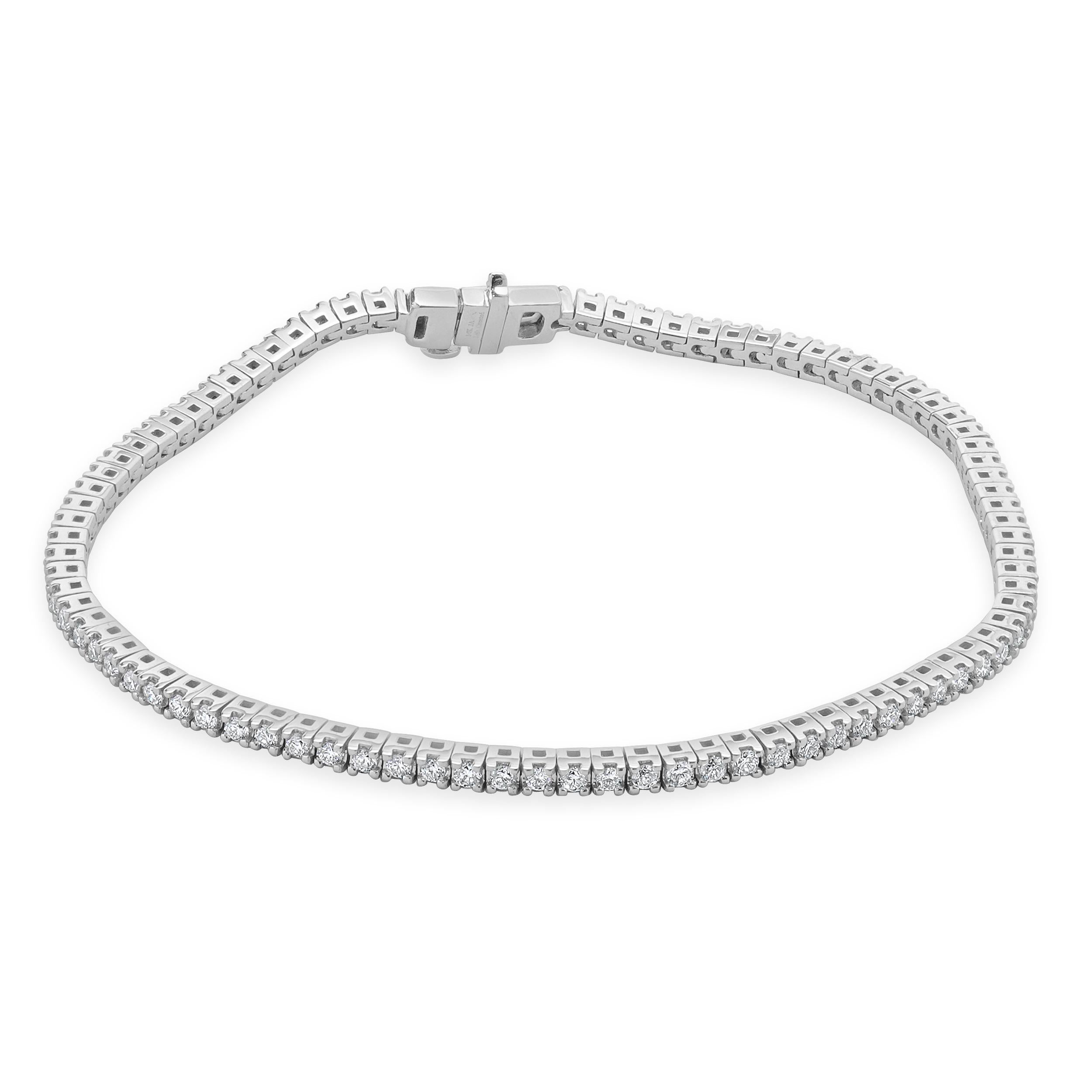Designer: custom design
Material: 14K white gold
Diamond: 89 round brilliant cut = 1.50cttw
Color: E/F
Clarity: SI1-2
Dimensions: bracelet will fit up to a 7-inch wrist
Weight: 8.43 grams
