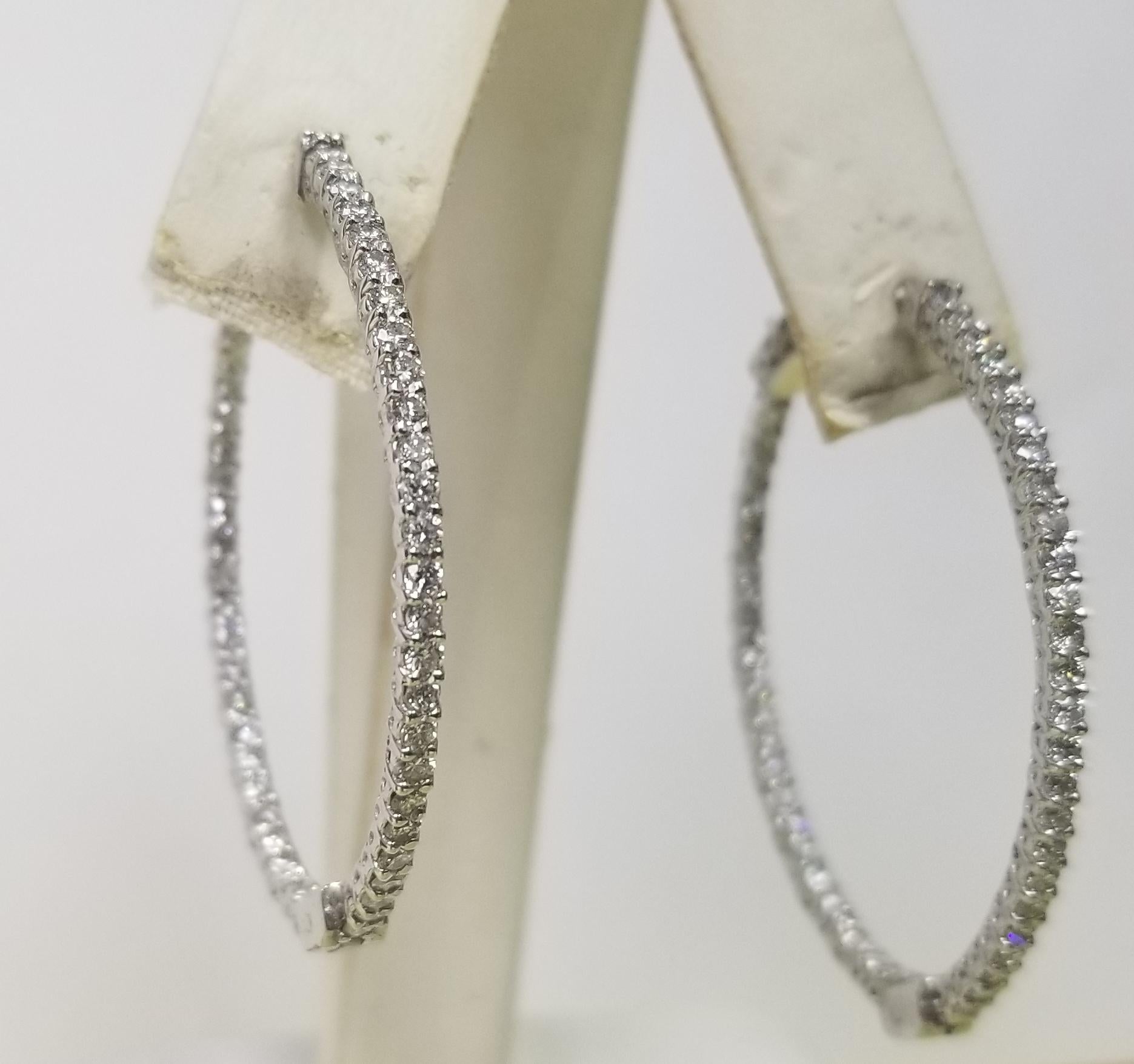 About
14k white gold large 1 1/2 inch long diamond hoop earrings
Specifications:
    main stone: 96 round Diamonds    
    carat total weight: 1.50CTW
    color: G
    clarity: VS
    metal: 14K WHITE GOLD
    type: HOOP EARRINGS
    weight: 7.50GRS 