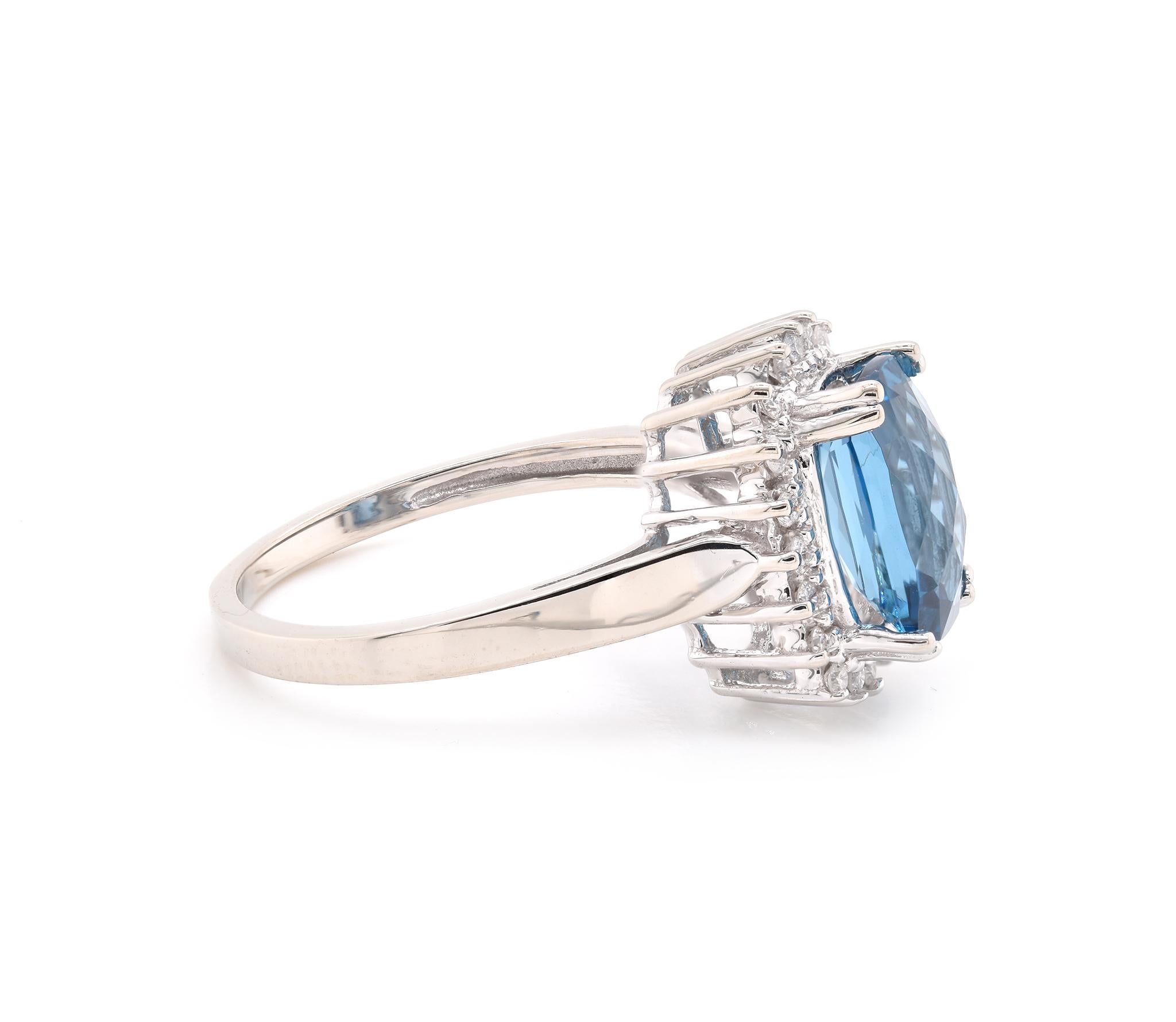 Designer: custom design
Material: 14K white gold
London Blue Topaz: 1 checkerboard cut cushion = 2.85ct
Diamond: 20 round cut = .20cttw
Color: G
Clarity: SI2
Dimensions: ring top measures 13.8mm long
Ring Size: 7 (please allow two extra shipping