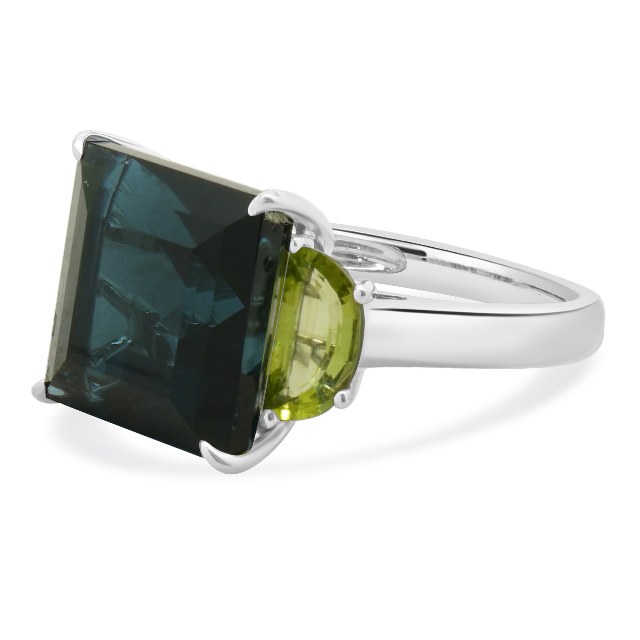 Designer: custom
Material: 14K white gold
Topaz: princess cut = 10.00cttw
Peridot: 2 half moon cut = 3.00ct
Ring Size: 6.5 (please allow two extra shipping days for sizing requests) 
Weight: 5.84 grams