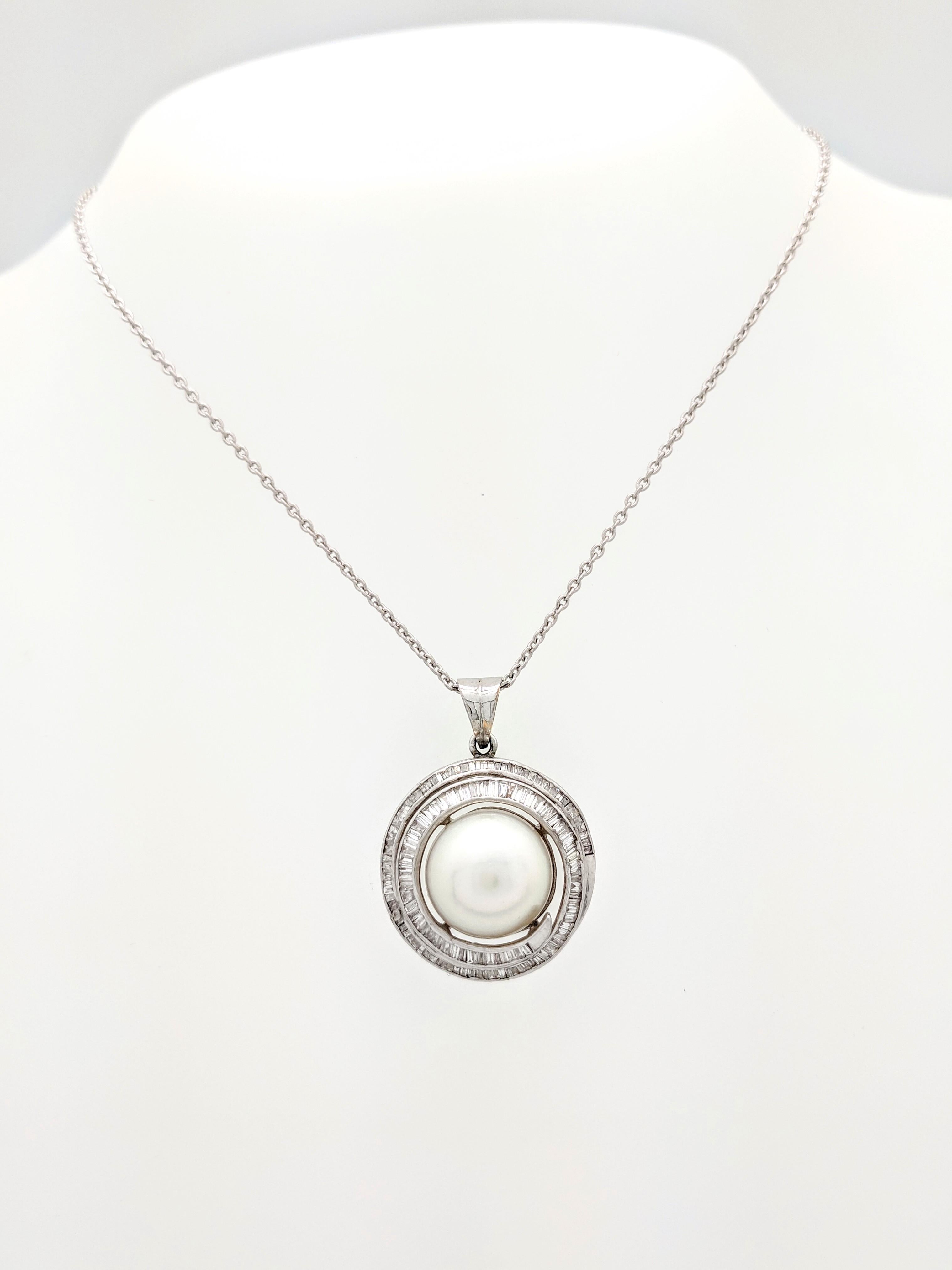 14K White Gold 11.5mm Mabe Pearl & Baguette Cut Diamond Swirl Pendant Necklace

You are viewing a beautiful mabe pearl & diamond pendant necklace.

This piece is crafted from 14k white gold and weighs 11.3 grams. It features approximately (1) 11.5mm