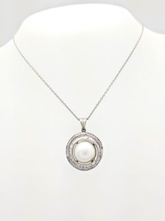 14 Karat White Gold Mabe Pearl and Baguette Cut Diamond Swirl Pendant Necklace