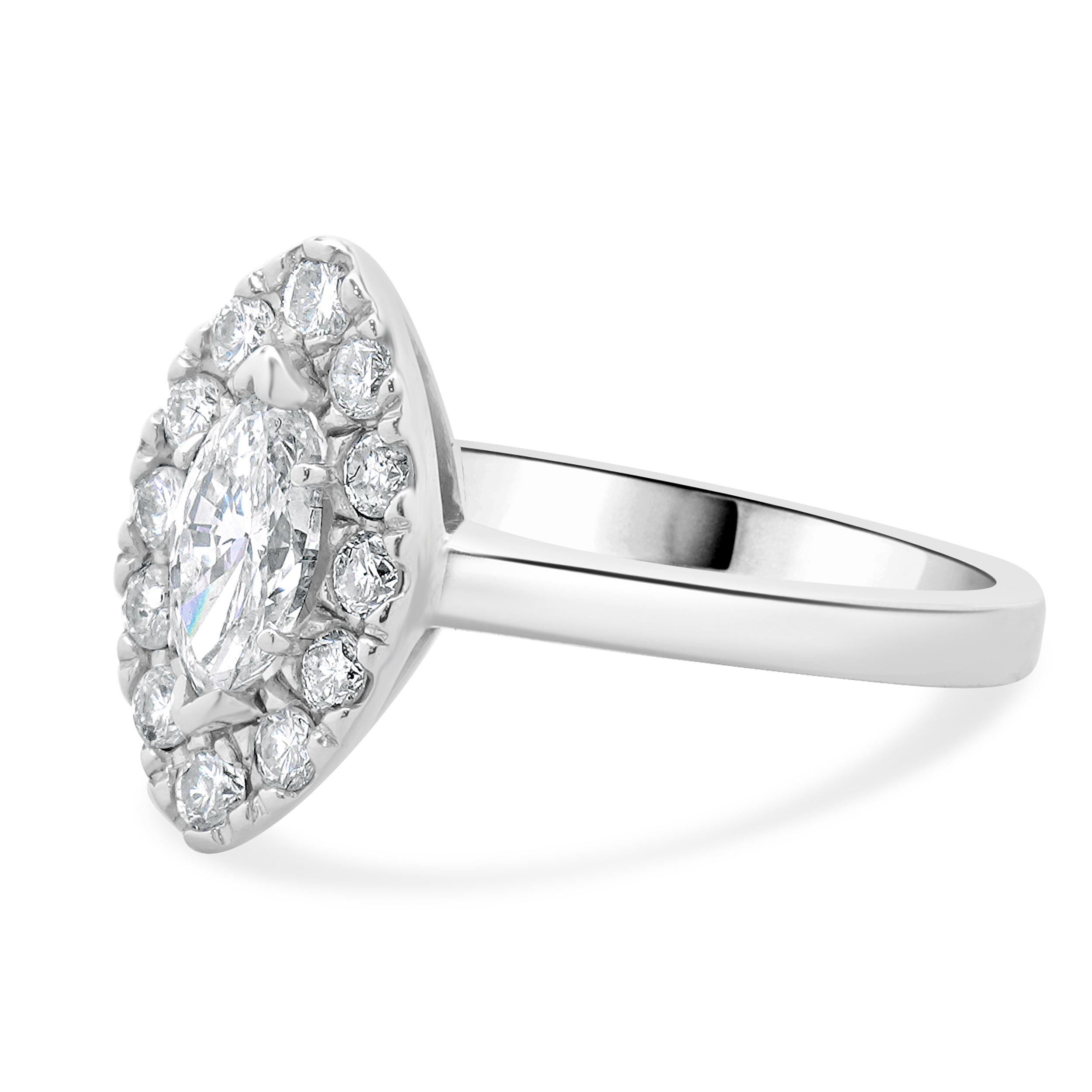 Designer: custom
Material: 14K white gold
Center Diamond: 1 marquise cut = 0.50ct
Color : F/G
Clarity : SI1
Diamond: 12 round brilliant cut = 0.25cttw
Color : G
Clarity : SI1
Dimensions: ring top measures 14mm
Size: 5.75 complimentary sizing