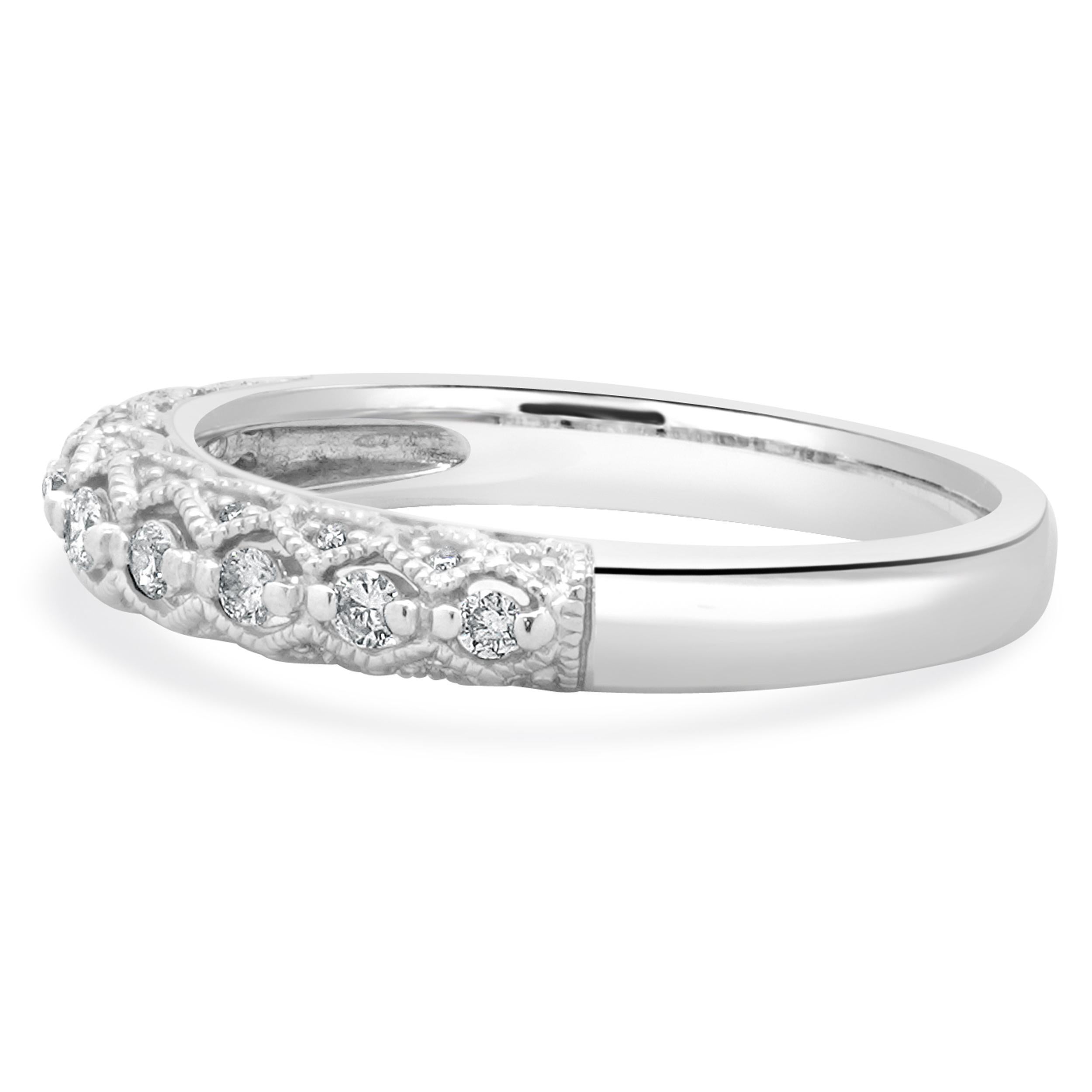 Designer: custom
Material: 14K white gold
Diamond: 25 round brilliant cut = 0.15cttw
Color: H / I
Clarity: SI2
Ring size: 7 (please allow two additional shipping days for sizing requests)
Weight: 3.17 grams