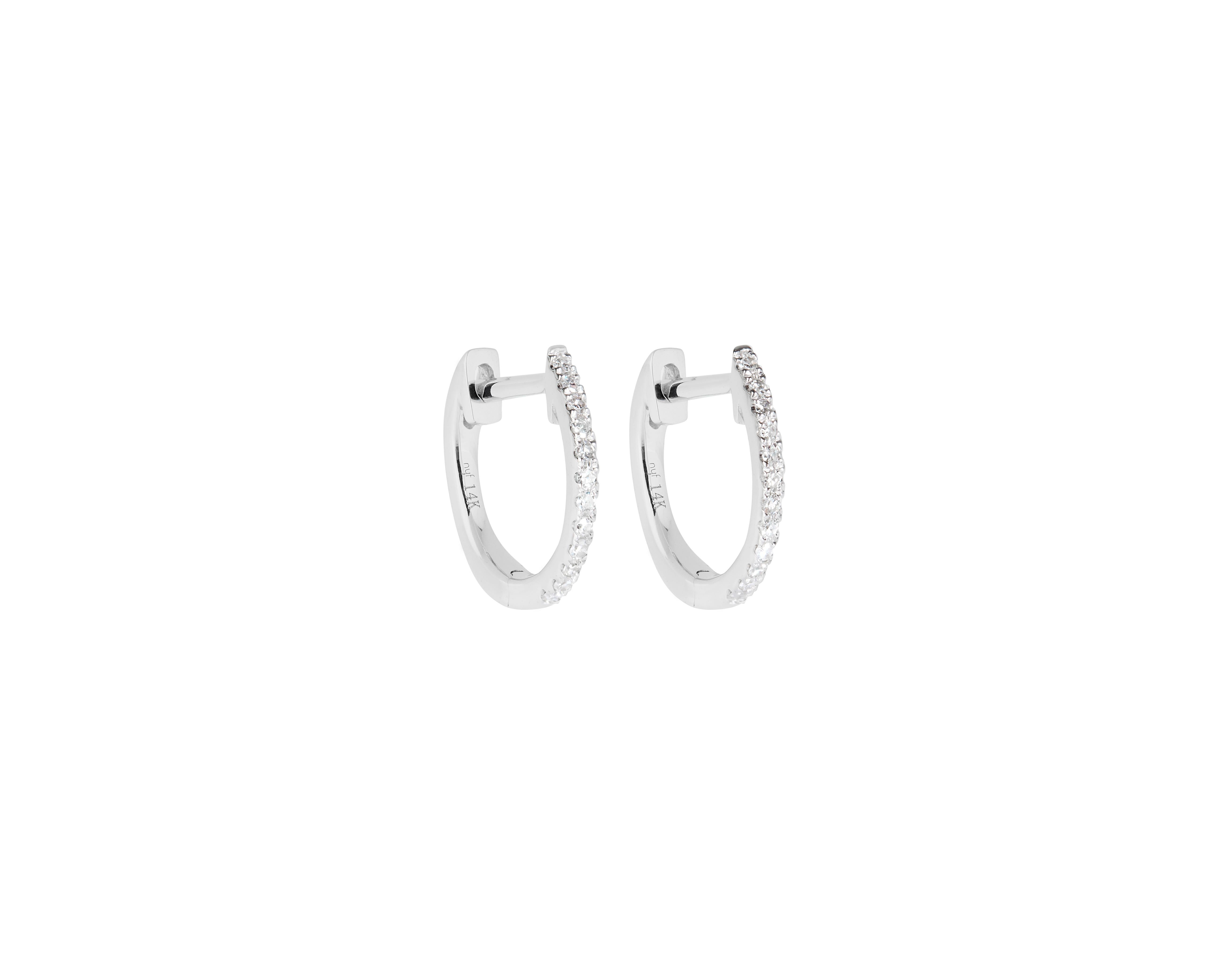 This pair of Mini Round Diamond Hoop Earrings is made in 14 karat White Gold, set with natural, colourless diamonds. With a total diamond carat weight (approximate) of 0.06 carat, The Diamonds are H colour, Si clarity. Internal dimension (from post