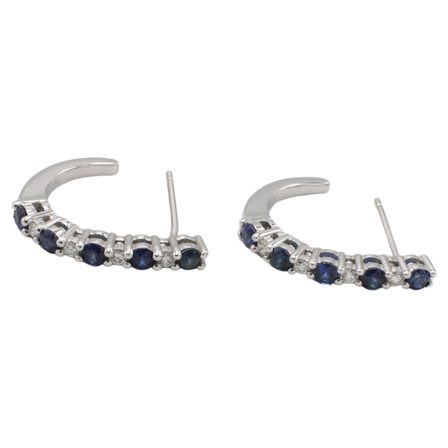 Pendientes de medio aro de oro blanco de 14 quilates con diamante natural y zafiro azul 
Metal: oro blanco de 14 quilates
Peso: 3.48 gramos
Diamantes: Aprox. 0.16 CTW G-H VS diamantes naturales redondos
Longitud: 17 mm
Anchura: 2.5 mm
KT F35000832
