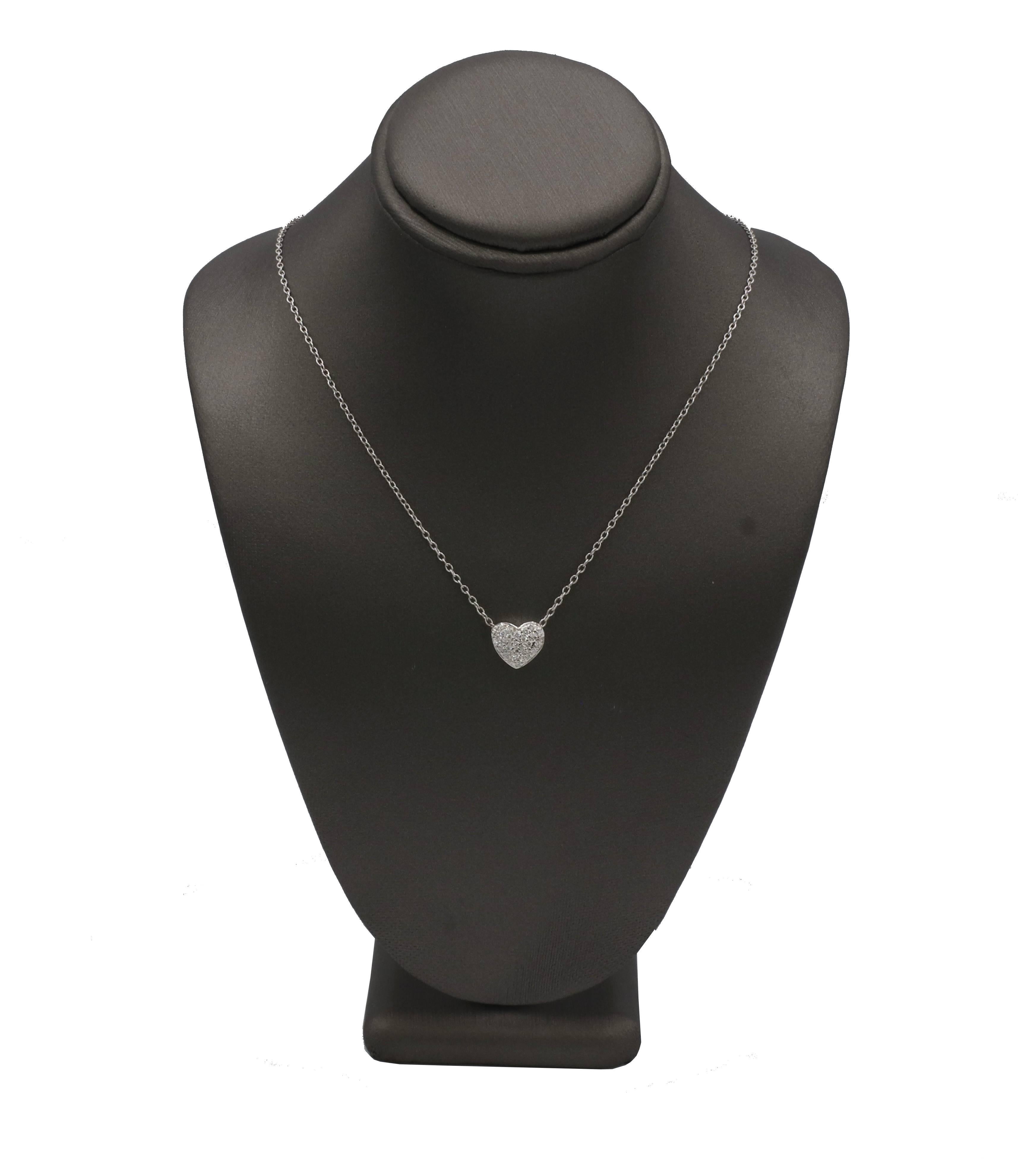 14 Karat White Gold Natural Pavé Diamond Heart Pendant Drop Necklace 
Metal: 14k white gold
Weight: 3.41 grams
Diamonds: Approx. 0.30 CTW F-G VS natural round diamonds
Heart: 9 x 10mm
Chain: 18 inches
LDD F35000131
