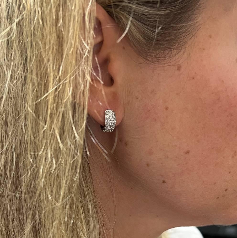Round Cut 14 Karat White Gold Natural Pavé Diamond Huggie Hoop Earrings For Sale