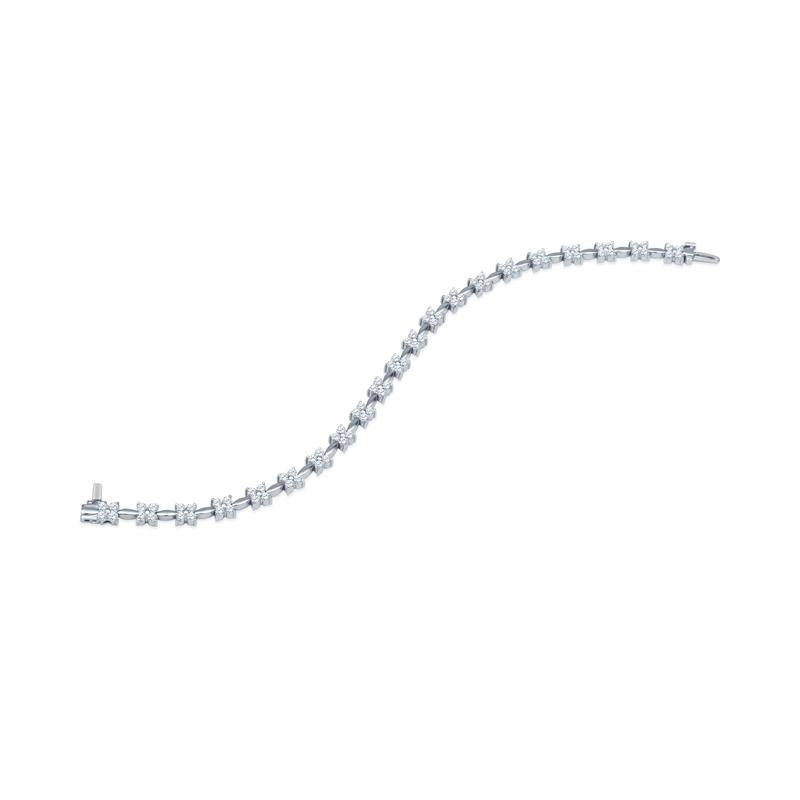 This unique bracelet features 3.02 carat total weight in natural round brilliant diamonds in a floral pattern and set in 14 karat white gold.  Wear this feminine bracelet alone of layer with your other favorite bracelets for a unique look.  Box