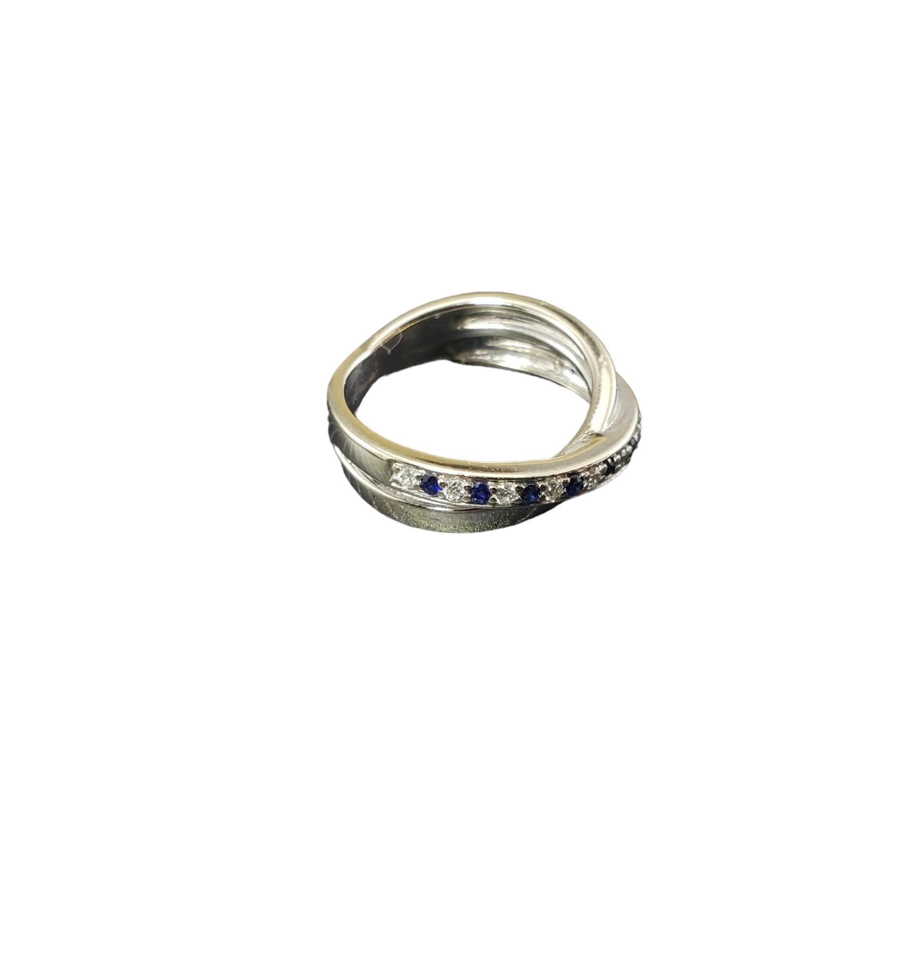 Vintage 14K White Gold Sapphire and Diamond Ring Size 4.75-

This elegant ring features 10 round blue sapphires and 11 round brilliant cut diamonds set in classic 14K white gold.  Width: 6 mm. Shank: 3 mm.

Approximate total diamond weight: .15