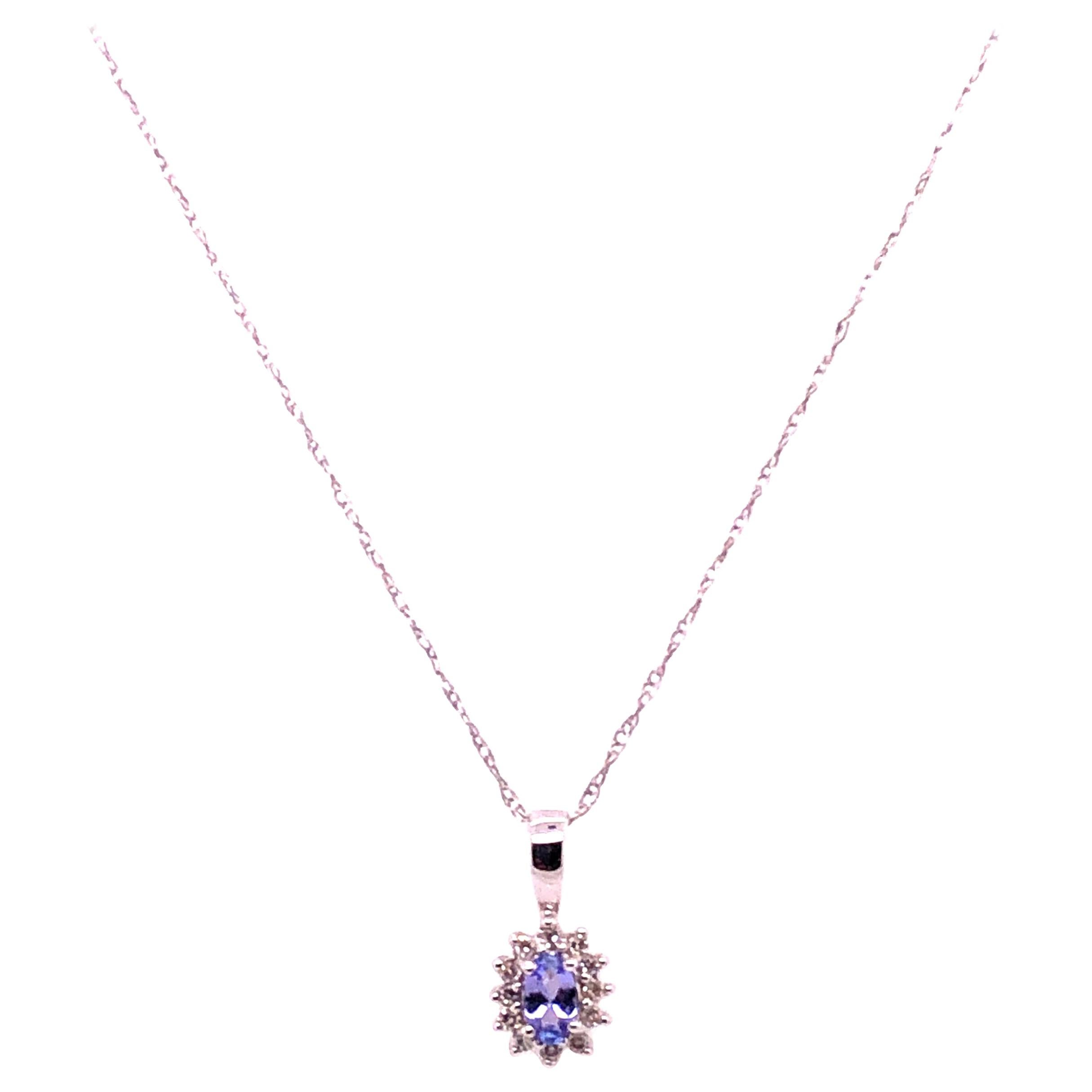 14 Karat White Gold Necklace with Diamonds and Oval Tanzanite Pendant For Sale