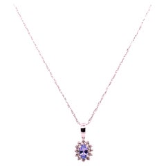 14 Karat White Gold Necklace with Diamonds and Oval Tanzanite Pendant