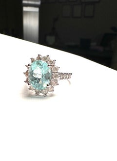 14 karat white gold neon 4.50 Carat Paraiba Tourmaline halo diamond ring