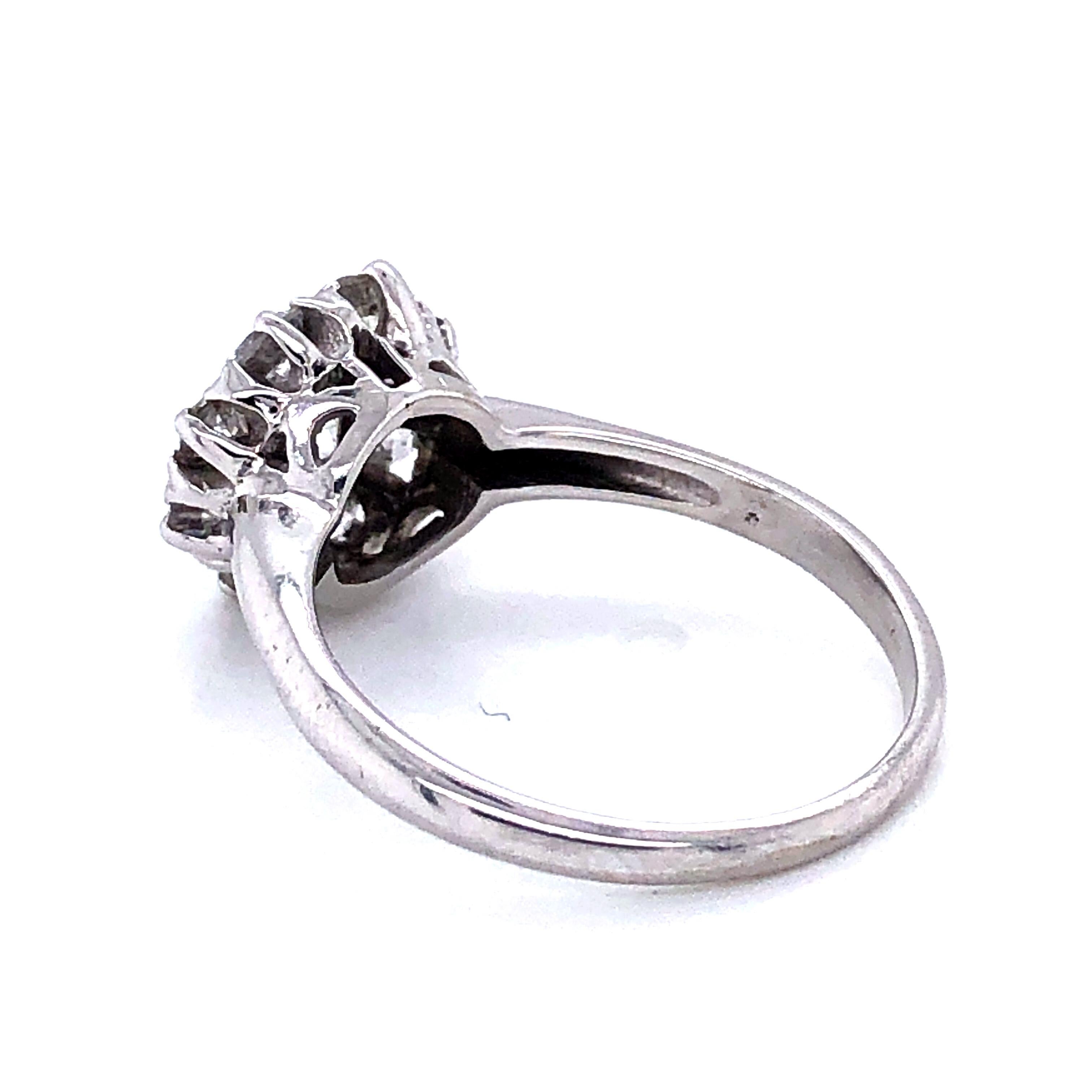 One 14 karat white gold engagement ring featuring one prong set Old Mine cut diamond, approximately 0.33 carat total weight with I/J color and SI clarity, surrounded by seven Old Mine cut diamonds and one modern round brilliant diamond,