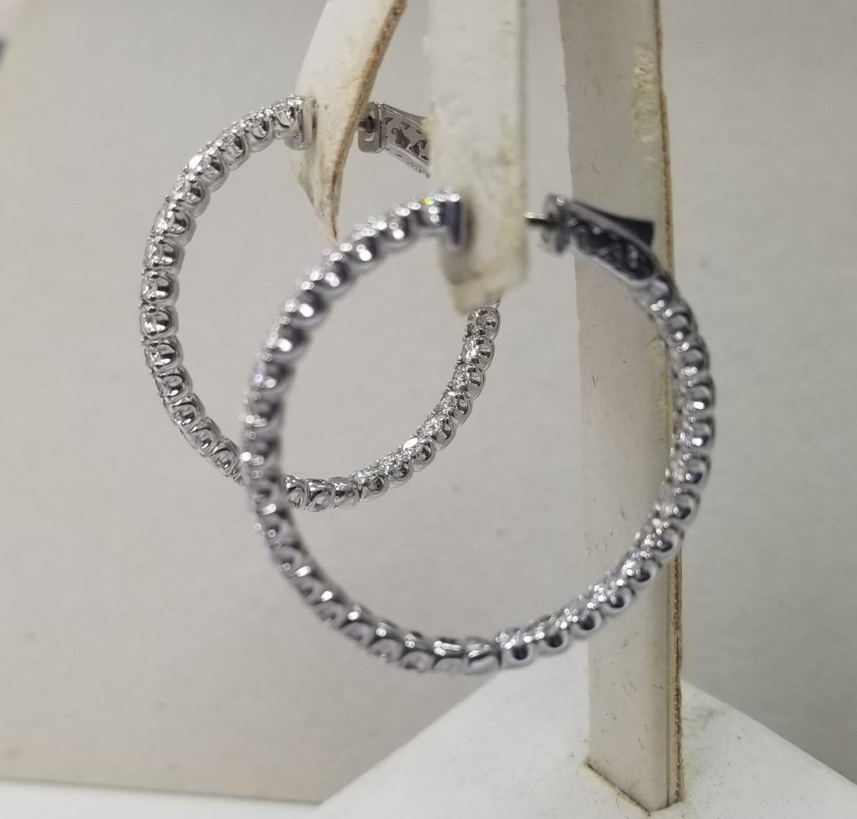About
14k white gold large 1 1/4 inch in diameter diamond hoop earrings
Specifications:
    main stone: 62 round Diamonds    
    carat total weight: 4.25CTW
    color: G
    clarity: VS
    metal: 14K WHITE GOLD
    type: HOOP EARRINGS
    weight:
