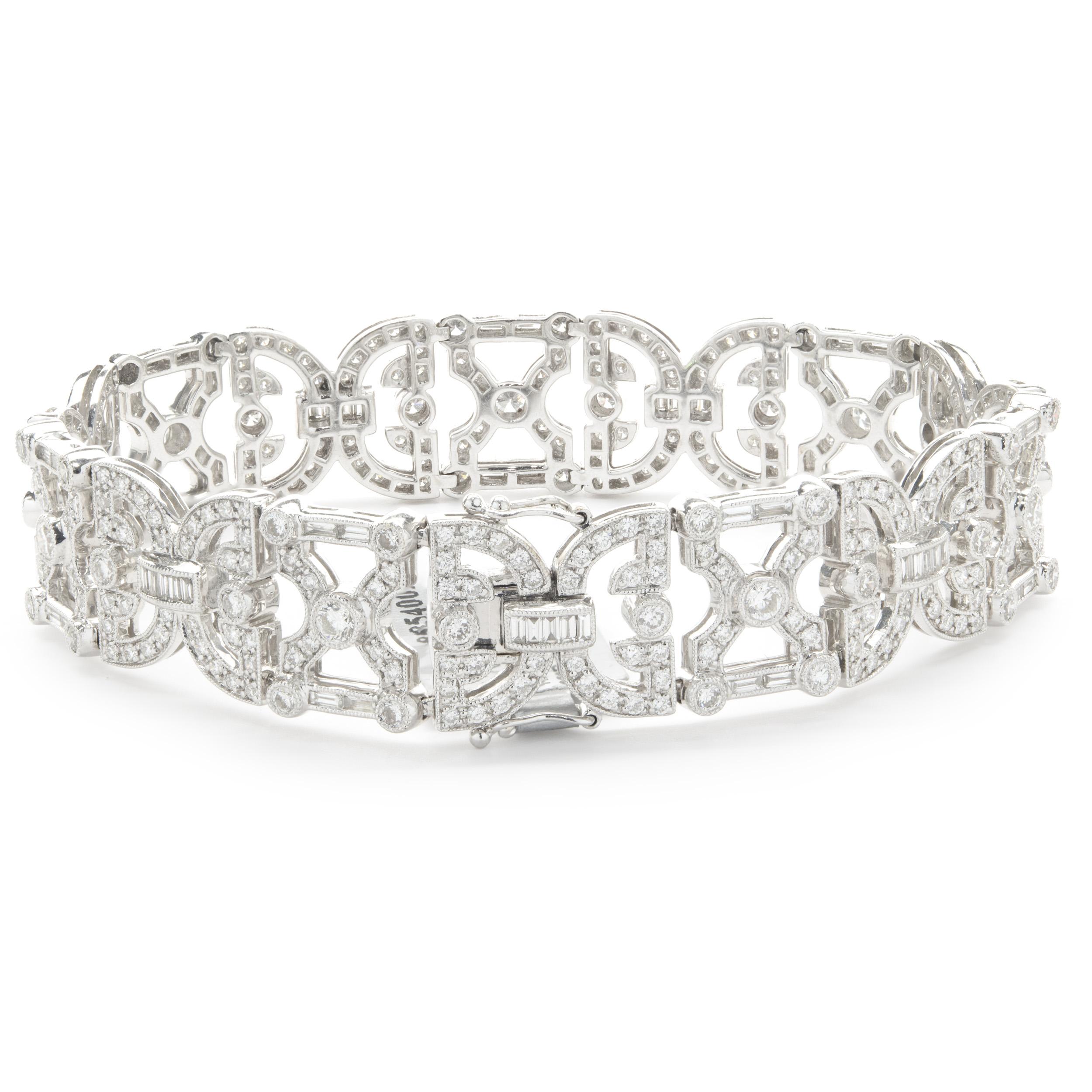 Designer: custom design
Material: 18K white gold
Diamonds: 392 round brilliant and baguette cut = 5.31cttw
Color: G
Clarity: SI1
Dimensions: bracelet will fit up to a 7-inch wrist
Weight: 35.62 grams
