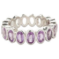 14 Karat White Gold Oval Bezel Set Pink Sapphire Band