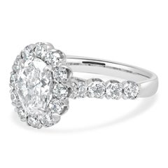 14 Karat White Gold Oval Brilliant and Round Cut Diamond Halo Engagement Ring