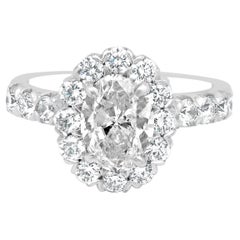 14 Karat White Gold Oval Brilliant and Round Cut Diamond Halo Engagement Ring