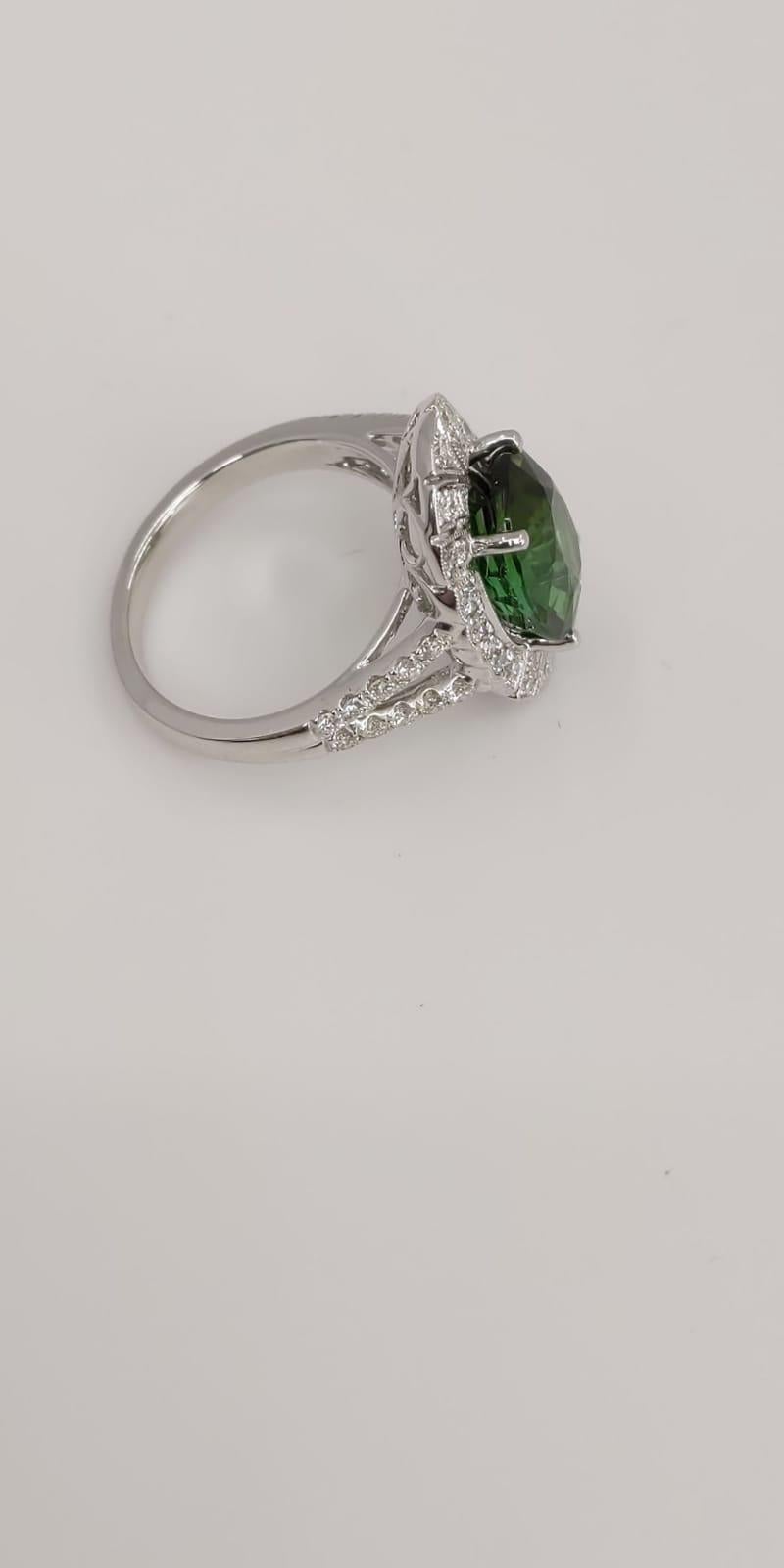 Contemporary 14 Karat White Gold Oval Cut Green Tourmaline and Diamond Ring