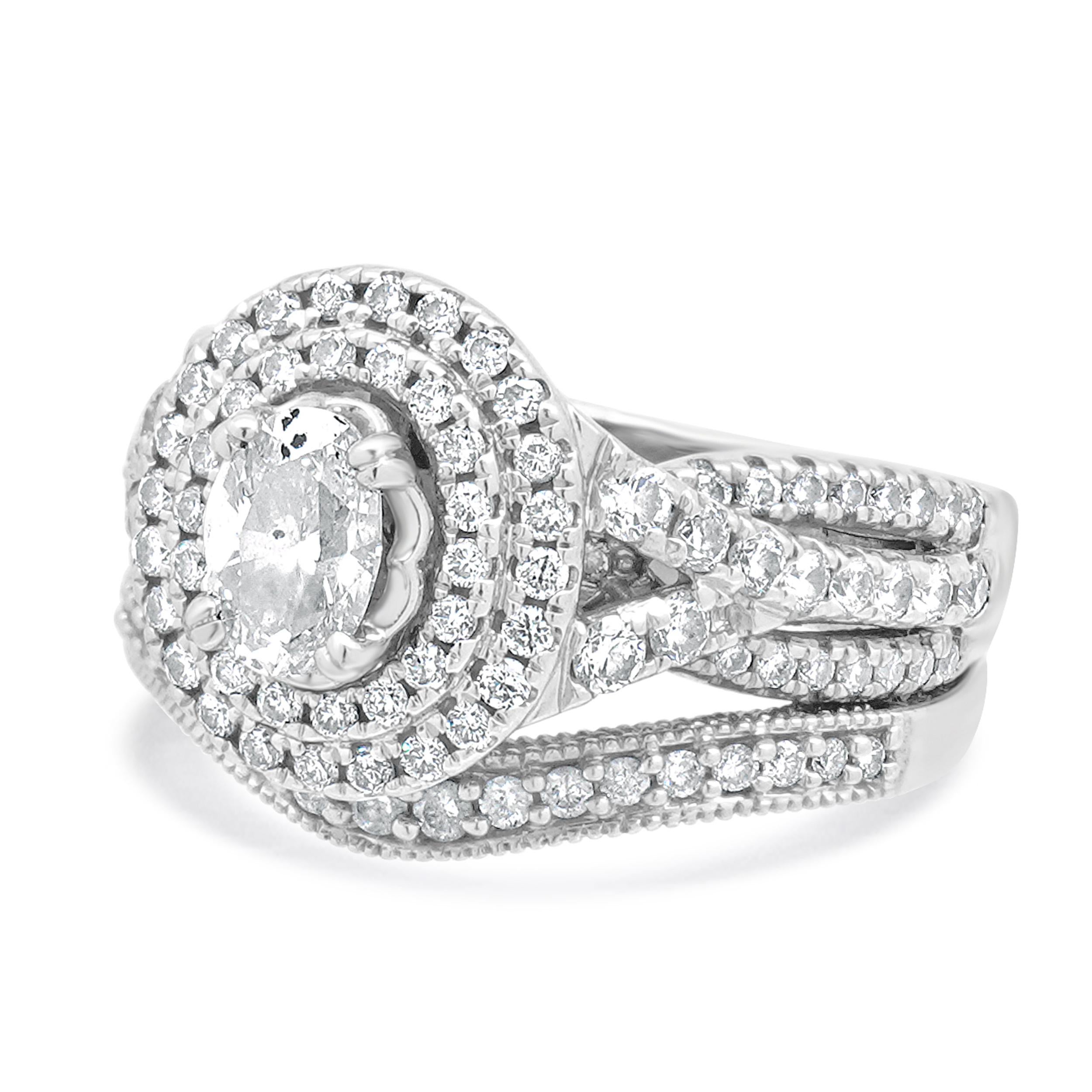 Designer: kundenspezifisch
MATERIAL: 14k weiß
Diamanten im Zentrum: ovaler Schliff = 0,50cttw
Farbe: I
Klarheit: I1
Diamant: 111 runde Brillanten = 0,75cttw
Farbe: H/I
Klarheit: SI1
Abmessungen: Die Ringspitze ist 13.95 mm breit.
Größe: 5