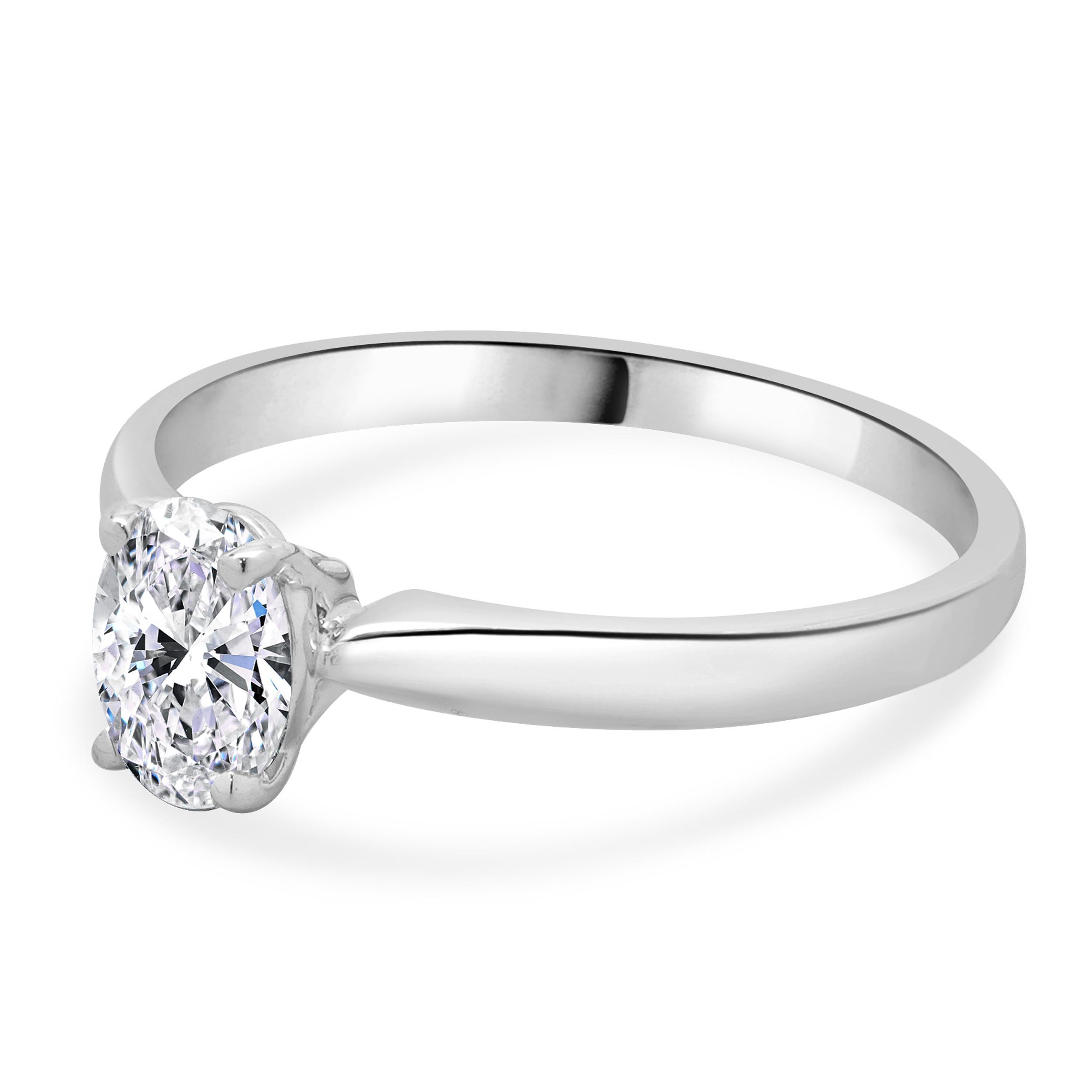 Designer: custom design
Material: 14K white gold
Diamond: 1 oval cut = 0.70ct
Color: F
Clarity: I1
Dimensions: ring top measures 2.3mm
Size: 7 complimentary sizing available 
Weight: 2.26 grams
