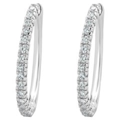 Pendientes de aro de diamantes ovalados de oro blanco de 14 quilates