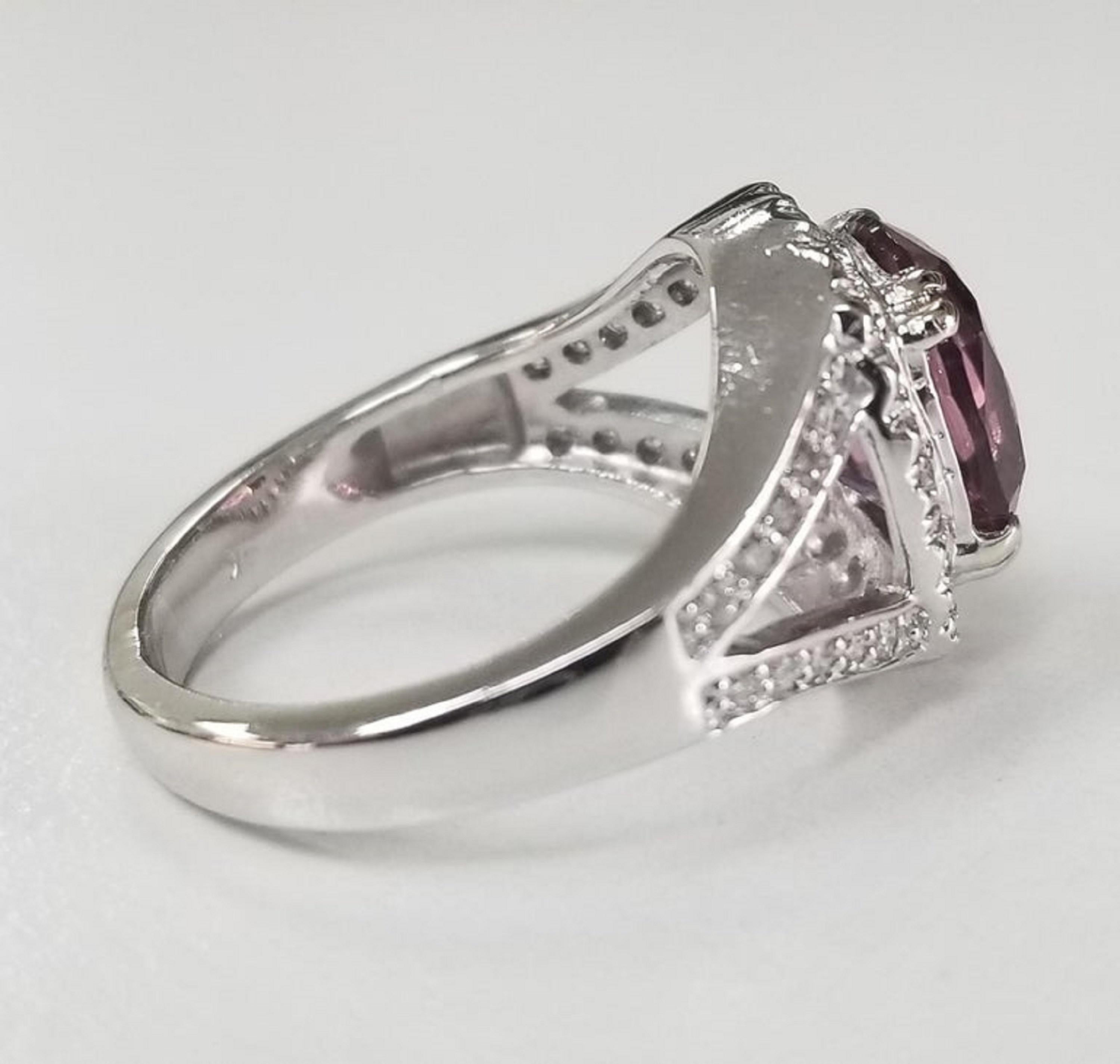 Oval Cut 14 Karat White Gold Oval Pink Tourmaline Diamond Halo Ring For Sale