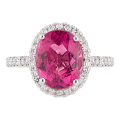 Bague en or blanc 14 carats avec tourmaline rose ovale et halo de diamants